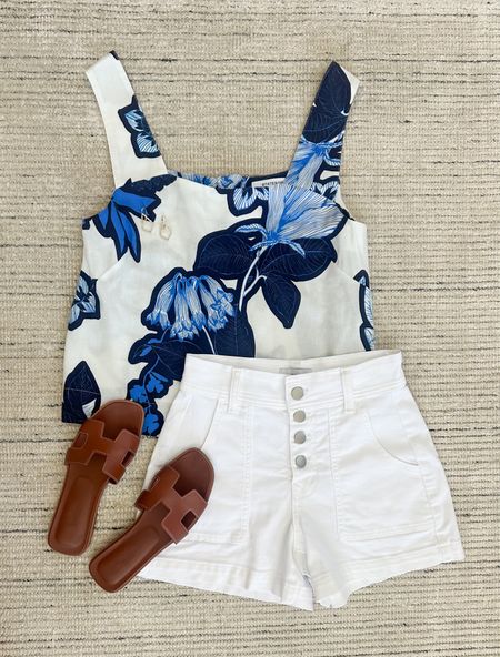 Summer outfit with blue floral tank paired with white denim shorts. I love this top for summer outfits, vacations and more! The white shorts are also a favorite of mine with the exposed buttons 

#LTKSeasonal #LTKStyleTip