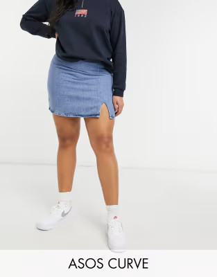 ASOS DESIGN Curve denim slit front mini skirt in midwash | ASOS (Global)