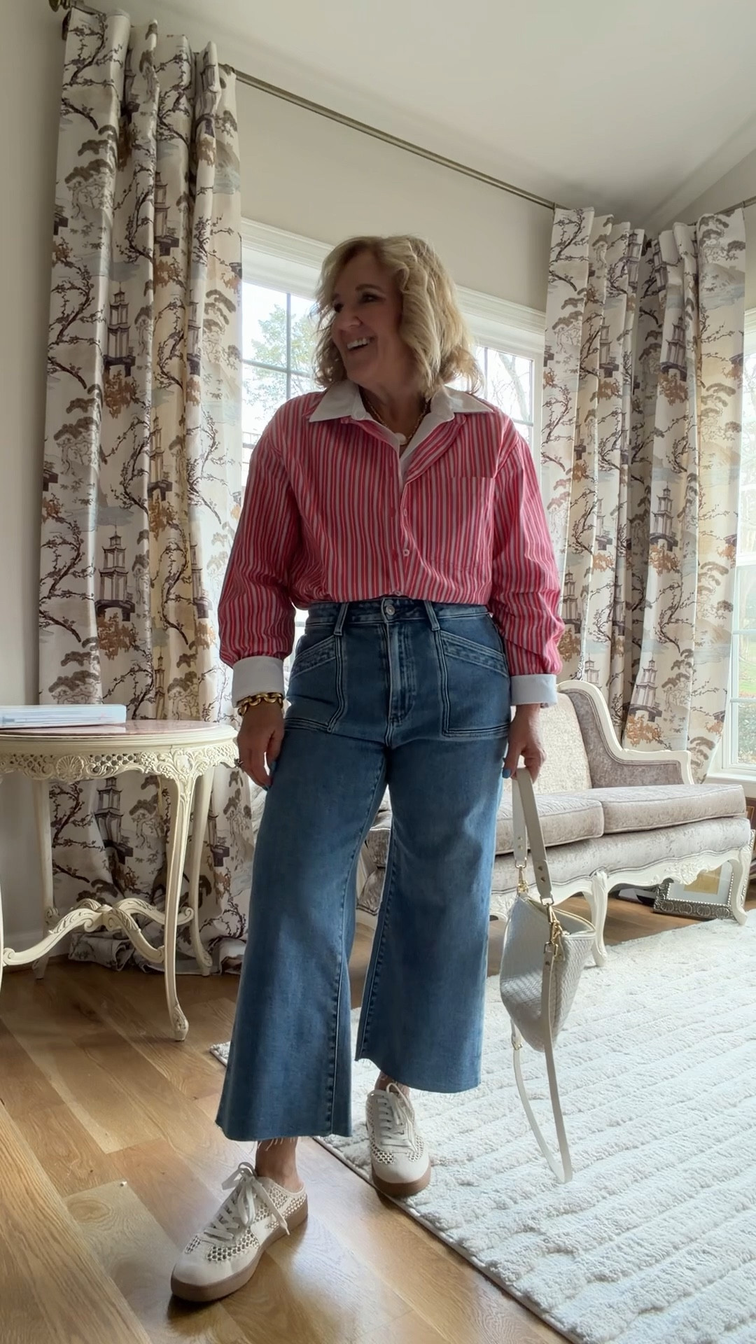 Anthro 20% off code NANETTE20 The coolest blouse! It’s a faux double layer with the under white blouse only being in the front. I’m wearing a medium. I would recommend sizing down to a small.
These are the Paige anessa my favorite premium denim. These are the crop ankle version and I’m wearing a size 29 petite 

#LTKPetite #LTKOver40 #LTKSpringSale