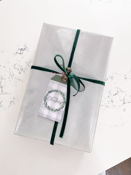 Silver wrapping paper and bells 

#LTKhome #LTKHoliday #LTKGiftGuide