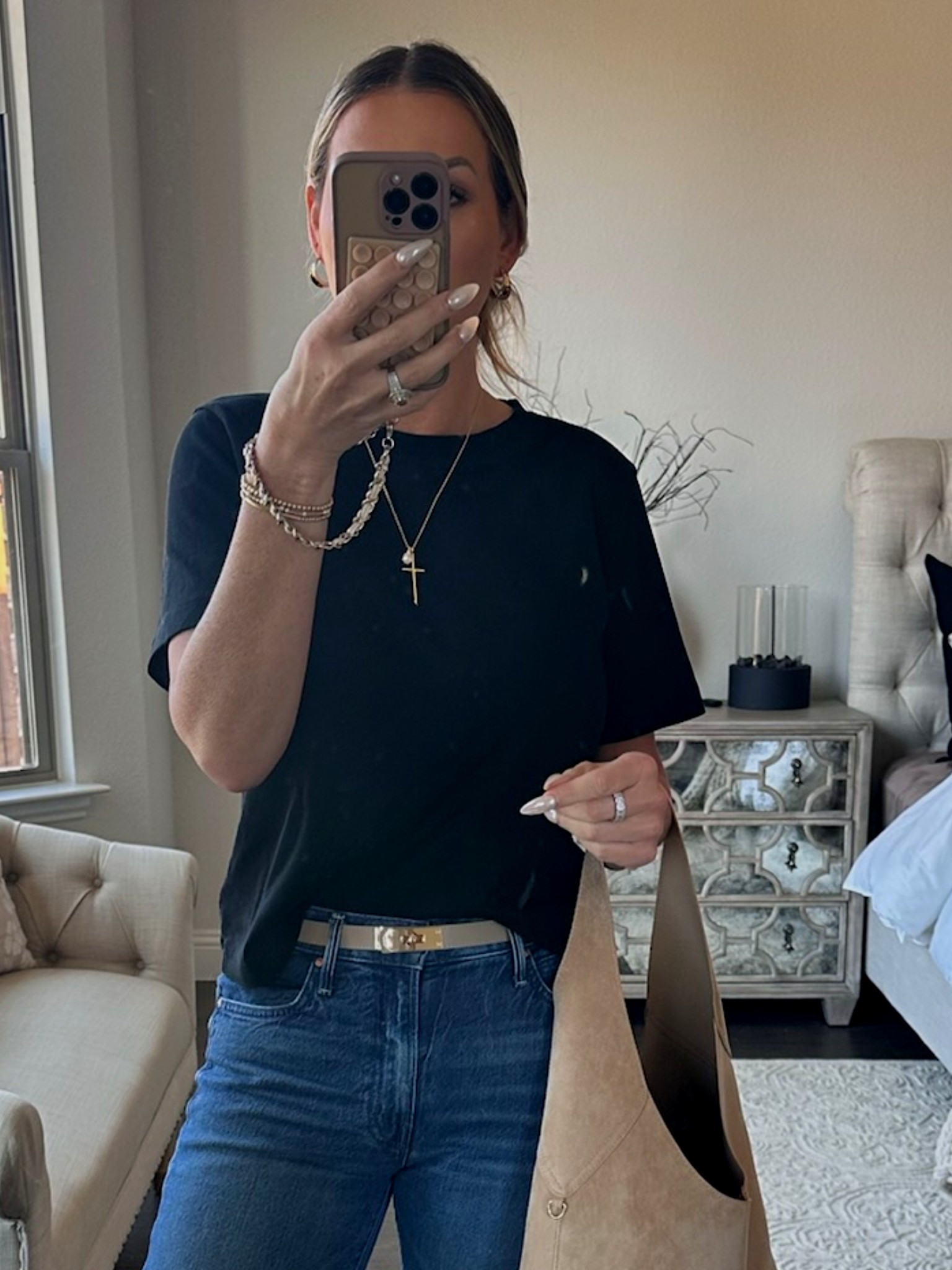 An easy, everyday outfit that proves simple pieces can still feel polished 🤍

I started with a classic black tee from Aritzia (the kind you’ll reach for on repeat), paired with my favorite Mother jeans for that relaxed-but-refined fit. The neutral accessories from Target keep everything feeling light and effortless, and I added a delicate Amazon cross necklace for a subtle finishing touch.

This is one of those real-life outfits that works for everything—errands, lunch, or just wanting to feel put together without overthinking it.

Simple pieces, styled intentionally ✨

#over40style #highlowstyle #everydaystyle #ltkstyle #christianinfluencer

#LTKSeasonal #LTKgrwm #LTKootd