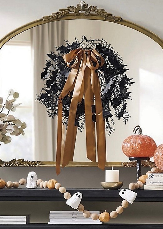Add a touch of chic spookiness to your Halloween entryway or mantel with the Batty Wreath with Ribbon 👻🖤 This 18” wreath features a playful flutter of bats layered on a natural grapevine base, finished with a bronze-colored ribbon and bow for a subtly feminine, elevated twist on Halloween style.

#LTKSeasonal #LTKHome