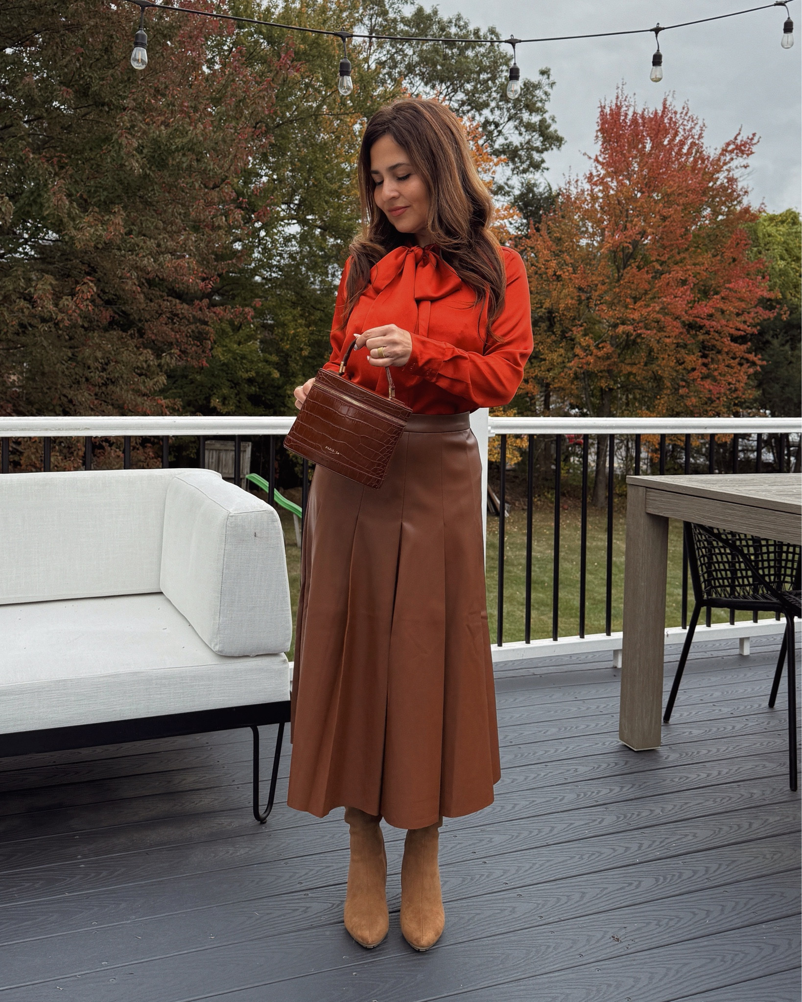 This espresso brown fall statement skirt paired with this feminine satin bow blouse is everything you need this season! 
Finish with this timeless chocolate brown bag that can be carried as a handbag or shoulder bag. You can give a sophisticated or informal touch to your look depending on your mood and style. Obsessed with these gorgeous suede boots as well!

Fall lookbook, fall street style, fall outfits, office outfits for fall weather 

#LTKSeasonal #LTKPetite #LTKItBag