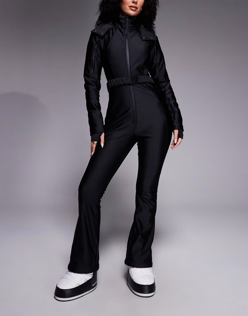 ASOS 4505 Hourglass Ski soft shell belted ski suit with slim kick leg and faux fur hood in black gloss | ASOS (Global)