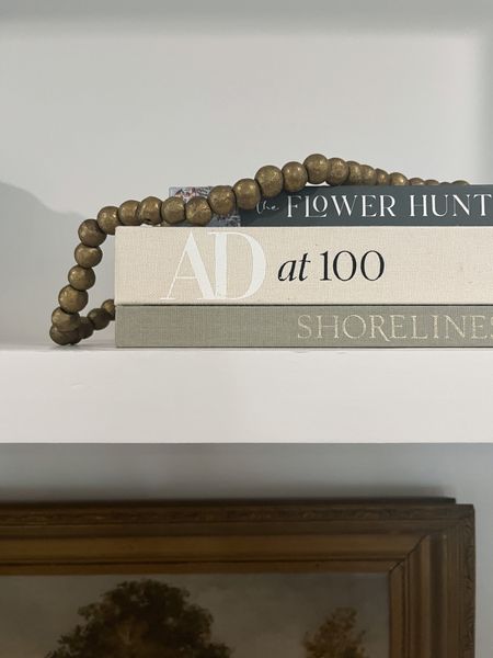 Brass bead garland ton of coffee table book stack 

#LTKstyletip #LTKhome