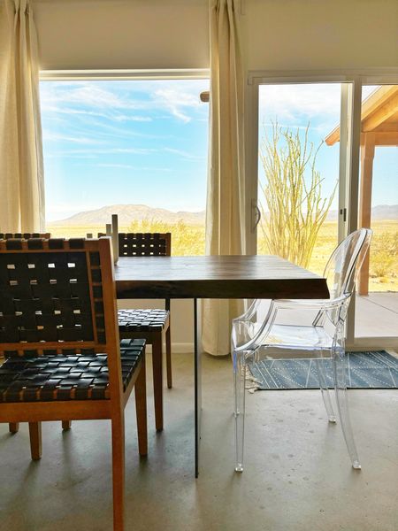 Nice views 👀 in our desert home @wondervalleyranchjoshuatree  near Joshua Tree National Park.  This dining table is a beauty!  The live slab sits on top of a piece of steel.  This table looks custom but it is from @wayfair 

#LTKHome #LTKTravel