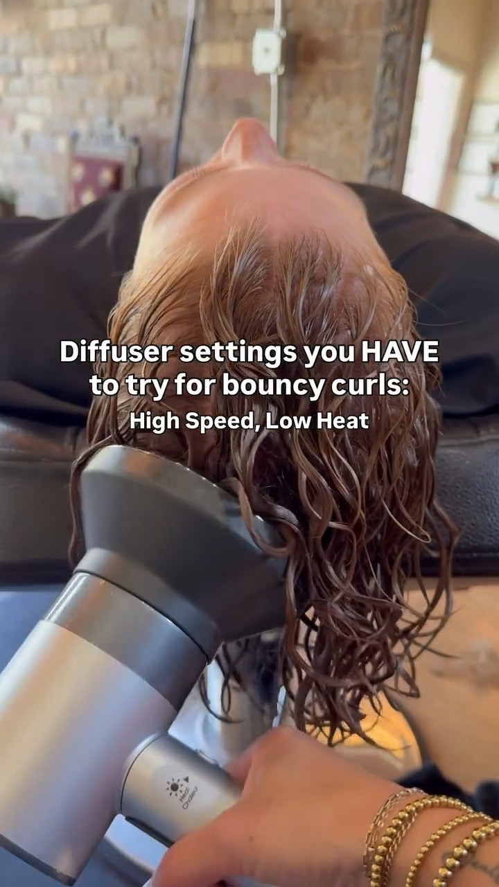 I will never stop telling you to turn your blow dryer speed UP and your heat DOWN!

The air is what dries your hair, but what we’re trying to avoid is damaging your hair and having curls facing odd directions because the heat is basically doing what a straightener does–forcing it into an unnatural position.

We want to dry curly hair fast with minimal damage. Turning your heat down still gets you less frizz and the volume blow drying provides, but doing so without damage is key here.

If you need some good dryer or diffuser options, comment VOLUME and I’ll send my favorites to you 🫶
.
.
.
#diffusersettingsforcurls
#curlyhairtips
#howtouseadiffuser
#curlspecialist
#diffusersettings