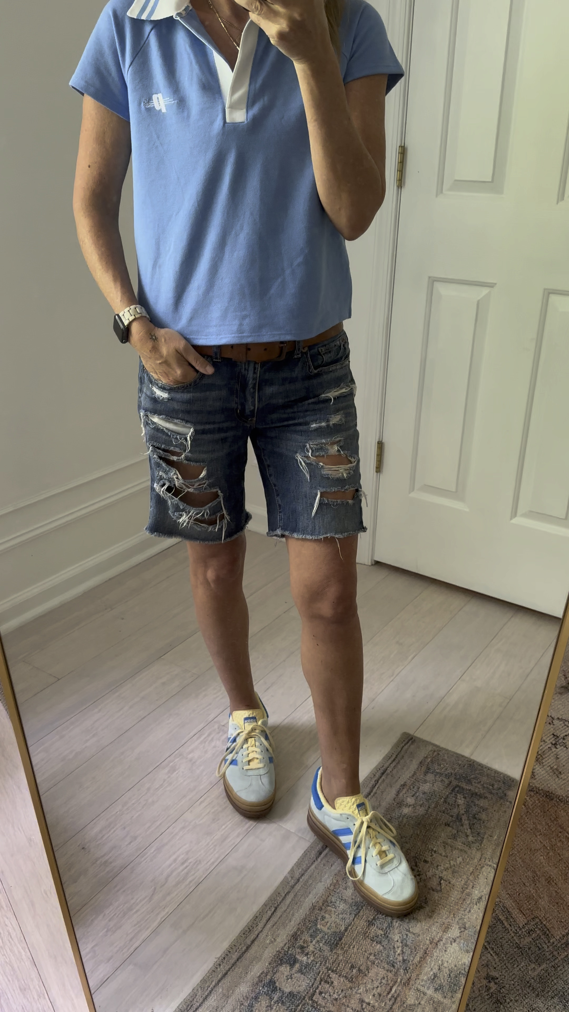 Ripped Bermuda jeans shorts, blue retro pickle ball shirt and Adidas gazelles 

#LTKOver40 #LTKVideo #LTKStyleTip