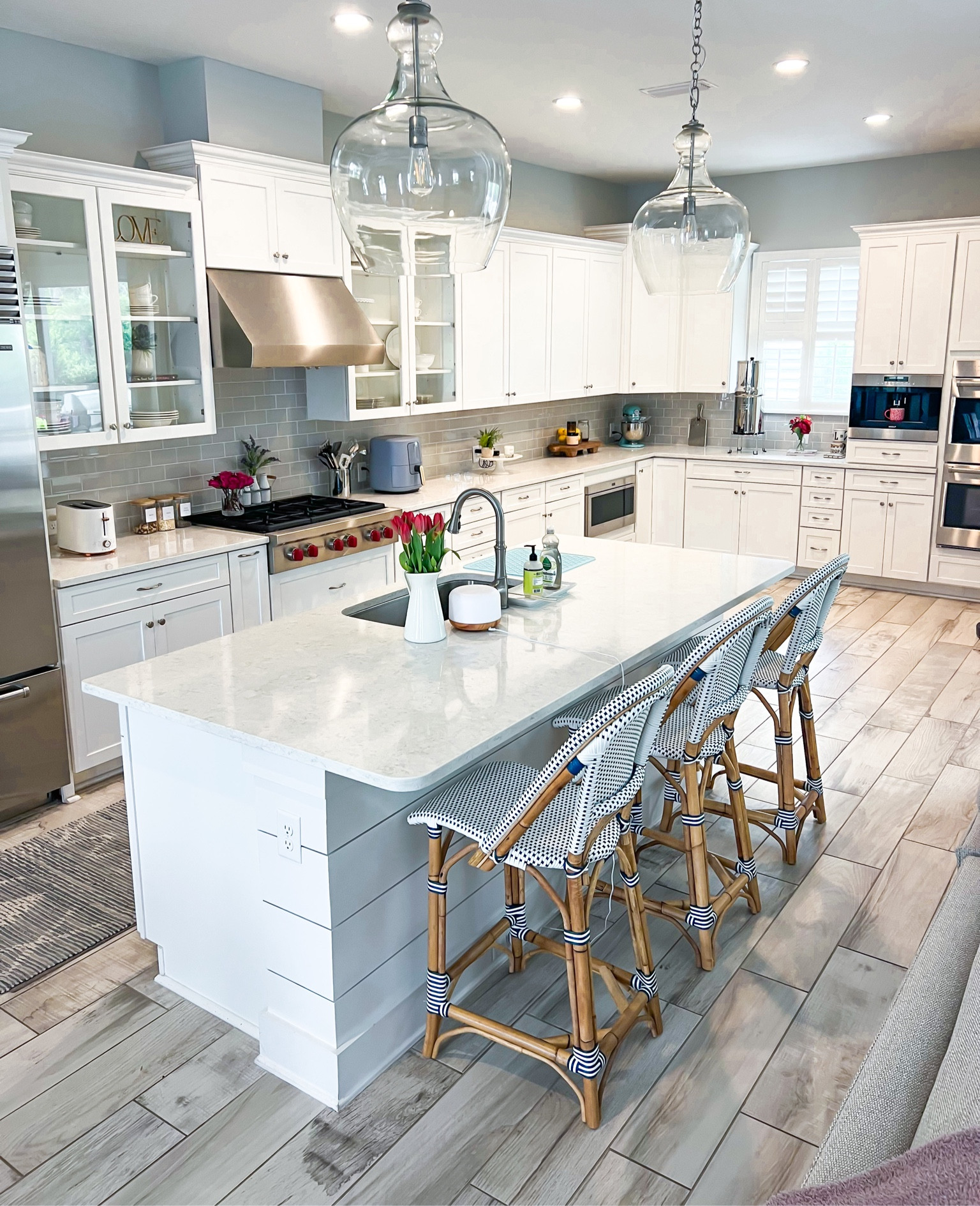 Coastal kitchen. Kitchen decor. Kitchen lighting. Serena and Lily Riviera counter stools (navy/white). Amazon kitchen favorites. Amazon kitchen finds. Serena and Lily kitchen rug. 