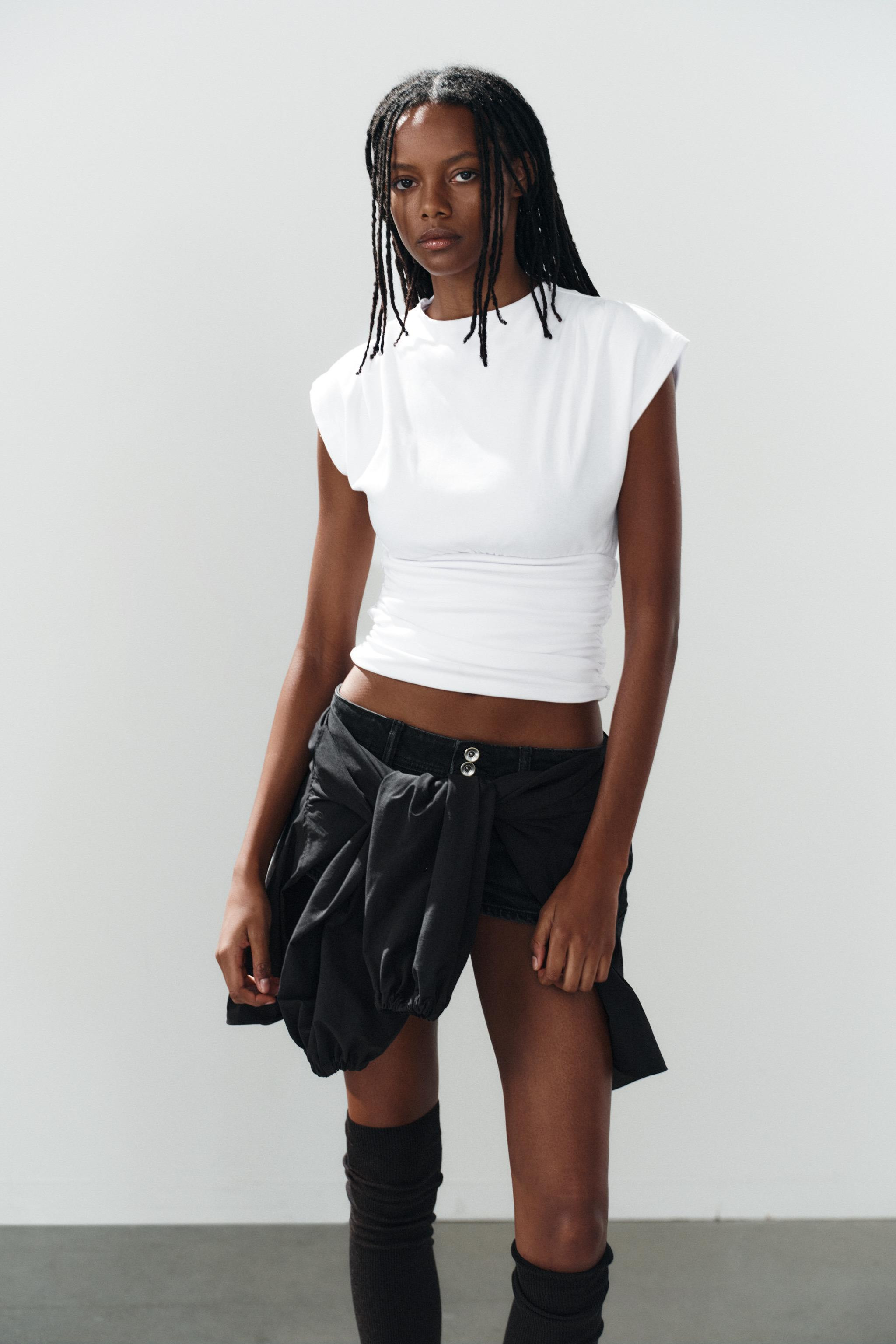 Top with a straight neckline and very short sleeves. Features a sash in the same fabric and side ... | Zara UK