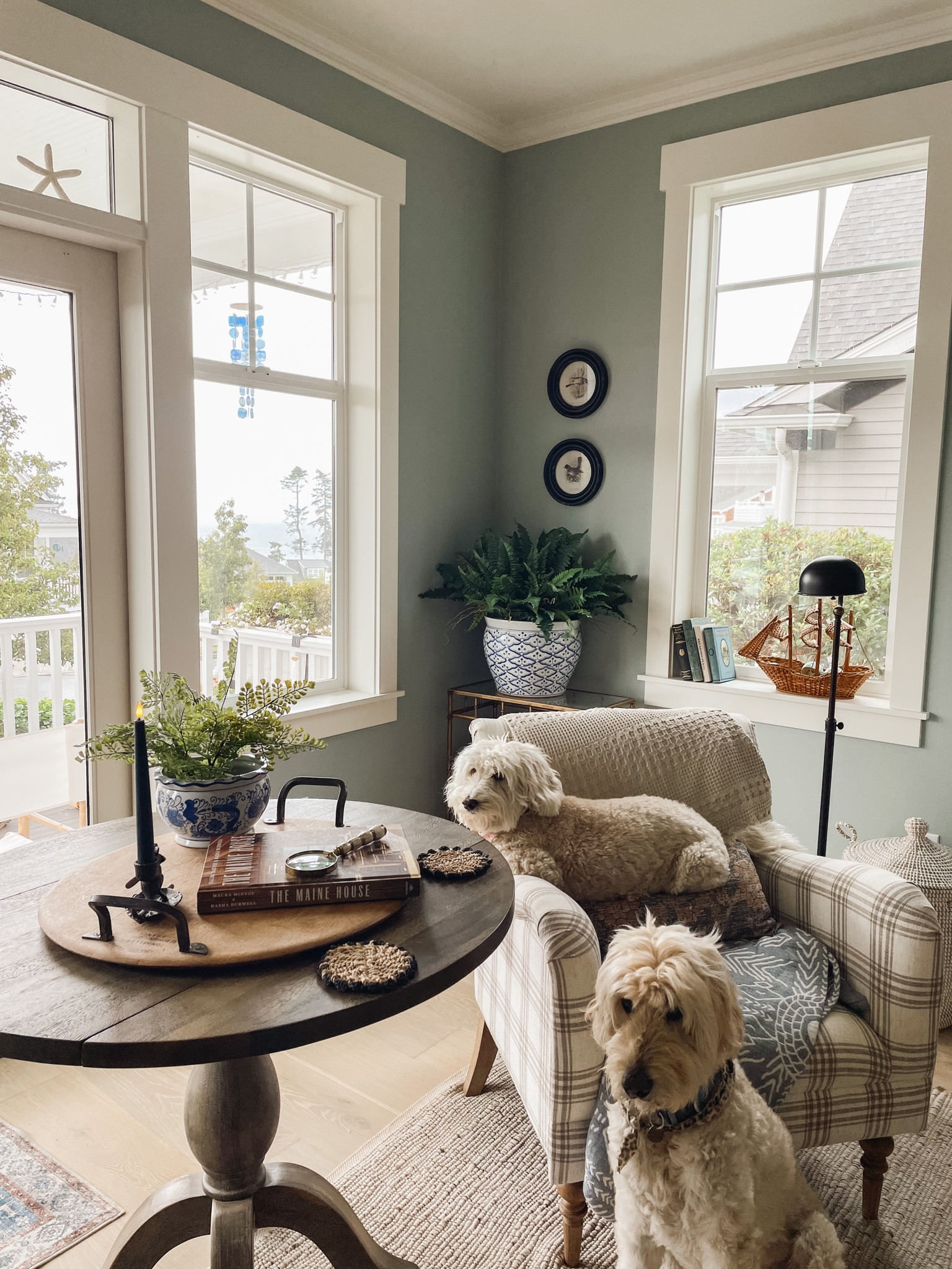 Rainy cozy day inside 🤍🍂 fall decorating, plaid chair, round black framed art, cozy blankets, black floor lamp, faux fern plant, lidded woven basket 

#LTKstyletip #LTKSeasonal #LTKhome