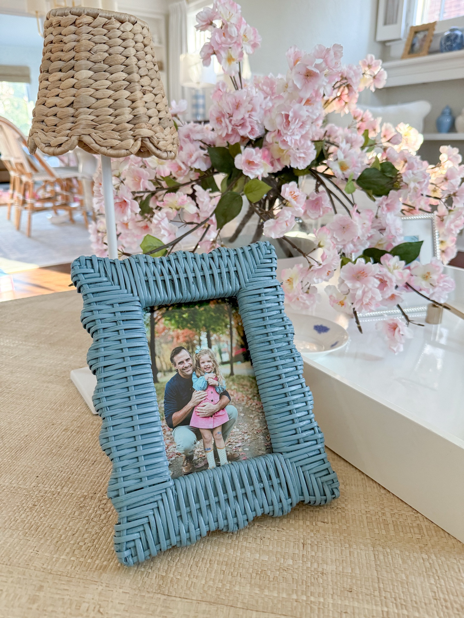 Coffee table decor and my new blue rattan picture frame from our family pictures this fall 💙

#LTKFindsUnder100 #LTKHome