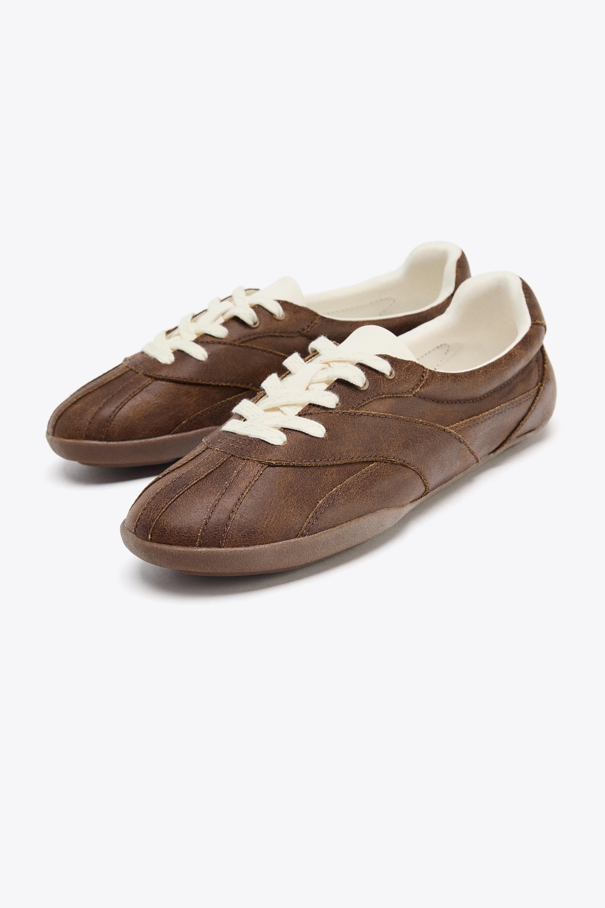SNEAKERS$ 59.90Brown | 5233/610/700Add to cartAddSneaker-style shoes. Topstitching detail on the ... | Zara US