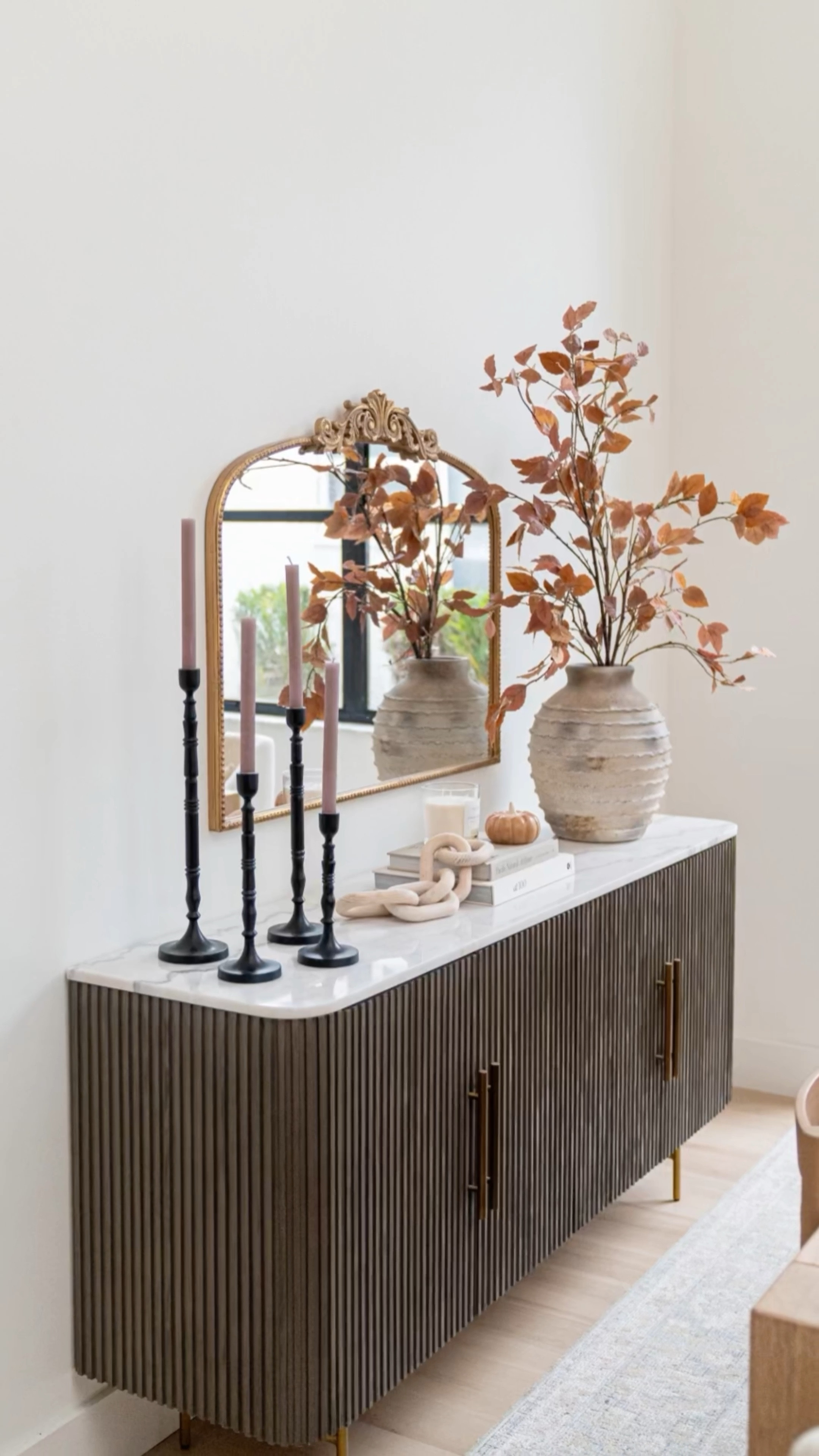Fall console table decor! Love these fall faux stems, candle holders, wood links and decorative books & pumpkin. Also linked our sideboard and gold mirror



#LTKFind #LTKhome #LTKSeasonal