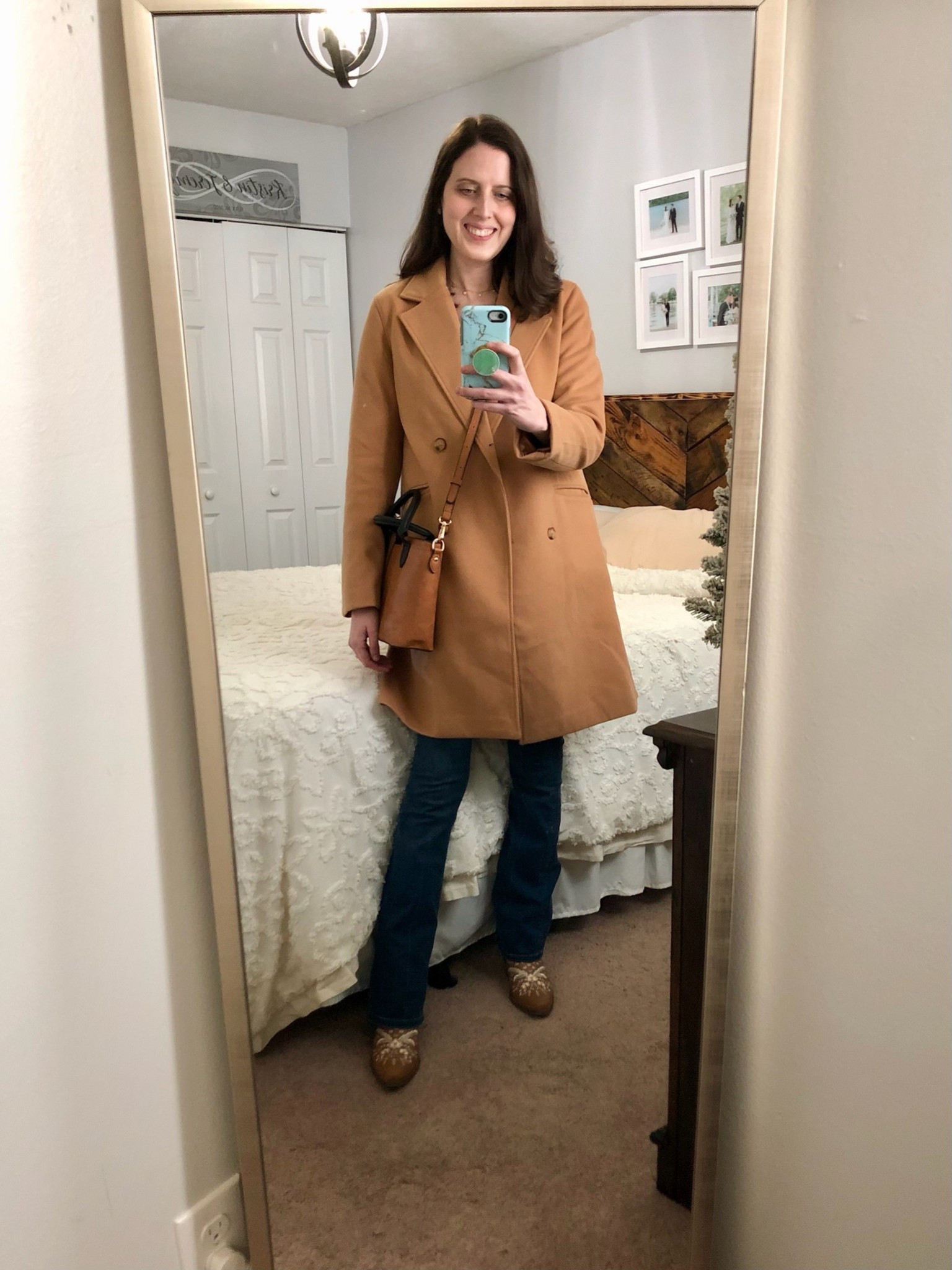 Camel pea coat and tan and black satchel handbag paired with bootcut jeans and embroidered cowboy boots 

#LTKFindsUnder100 #LTKootd #LTKSeasonal