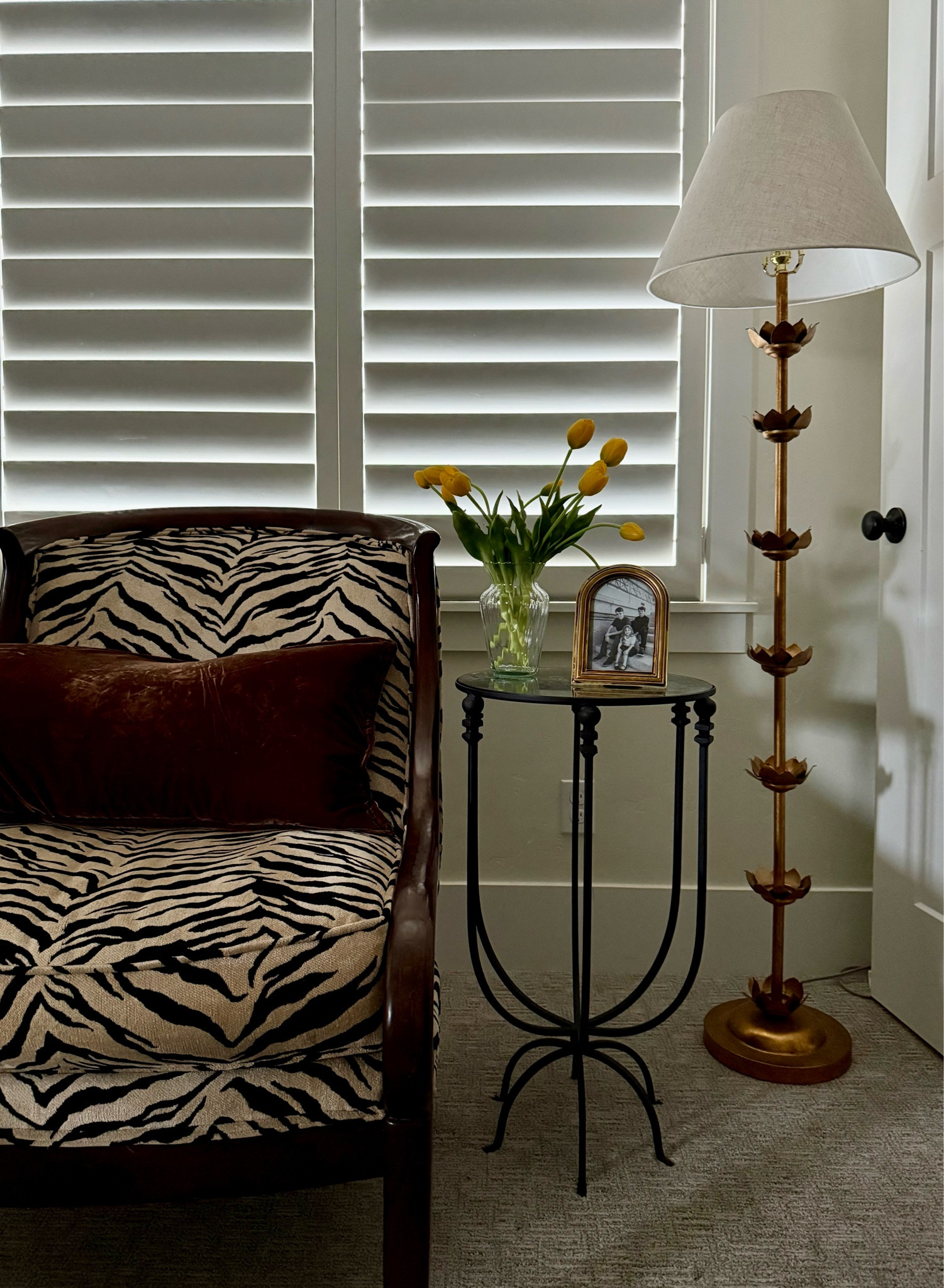 Bedroom vignette. 
Secondhand finds and looks for less. Obsessed with these real looking tulips, my husband thought they were real! 

Animal print, zebra print, iron side table, gold floor lamp, velvet pillow, faux florals. 

#LTKHome