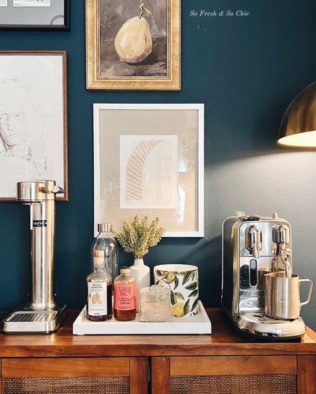 Coffee station styling in my home!
-
Target Studio McGee Hearth and Hand Magnolia - brass dome floor lamp - fruit still life framed art - affordable art - nespresso coffee machine - Aarke bubbling water maker - marble tray - Benjamin moore gentleman’s grey blue accent wall - dining room decor #coffeestationdecor - affordable home decor 

#LTKunder100 #LTKhome