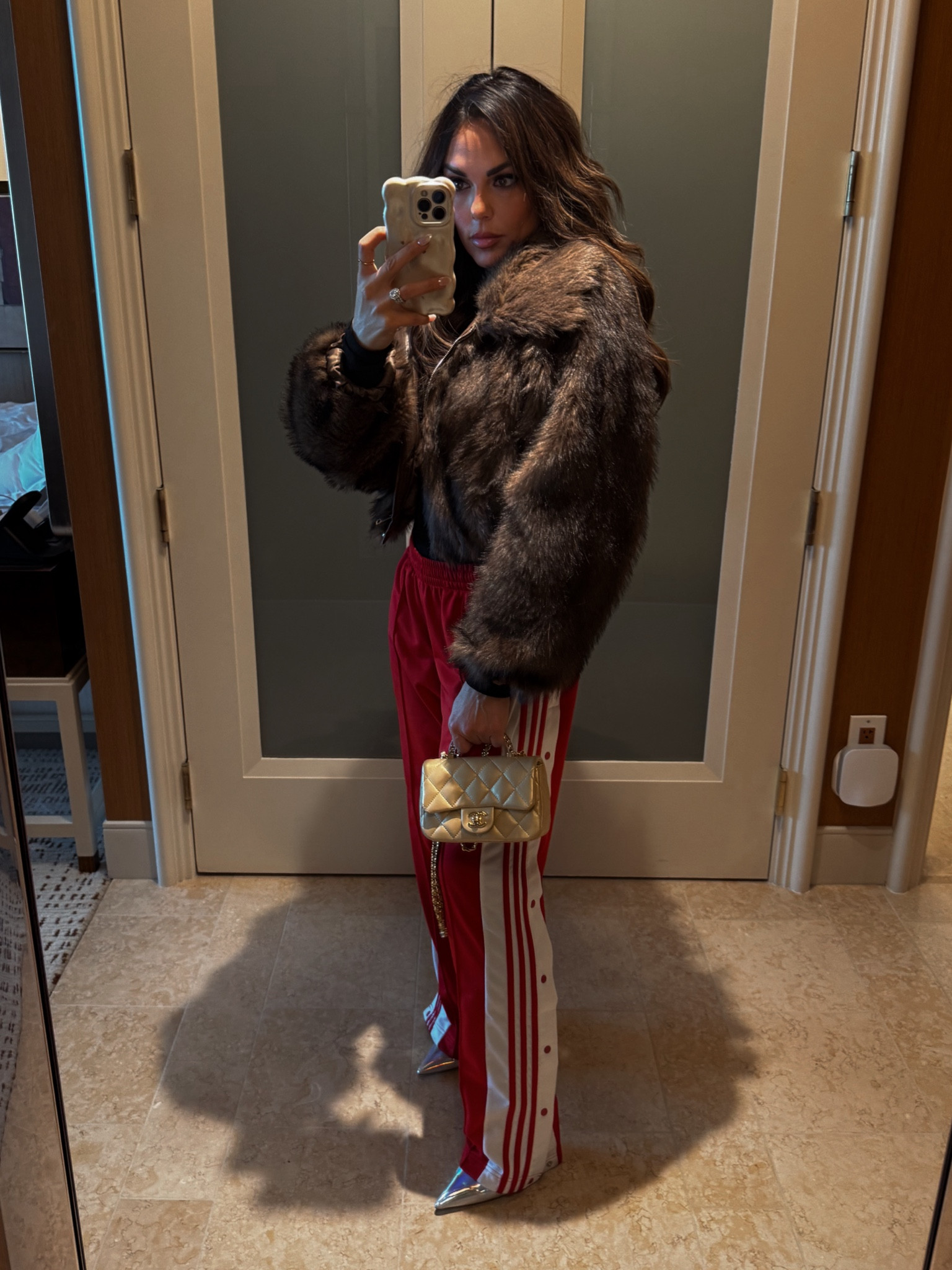Chic Winter Streetwear Outfit. Fur Coat. Track Pants. 