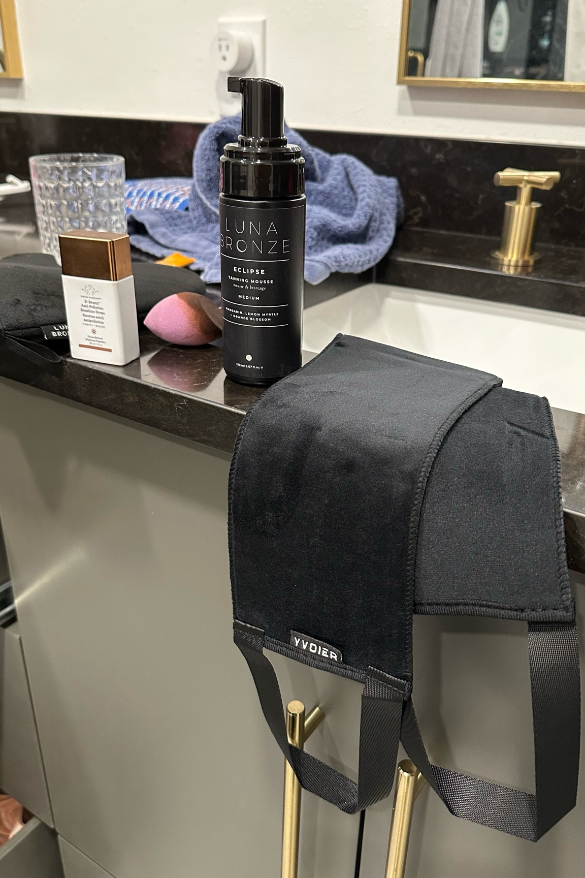 A few of my self tanning favorites: Luna bronze mit- it has a thumb spot which is a huge upgrade compared to other mits. Luna bronze tanning mousse in shade medium for a good bronze glow without being too dark for winter. I love how it applies and stays on throughout the week. Beauty blender to help with crevices like my fingers and hands. Drunk elephant tan drops that I use both on their own and with moisturizer. Back tanning helper to get spots you can’t reach with your mit. I also use tan lux butter for a gradual lotion. And be sure to scrub and shave prior to self tanning to help it last 

#LTKbeauty