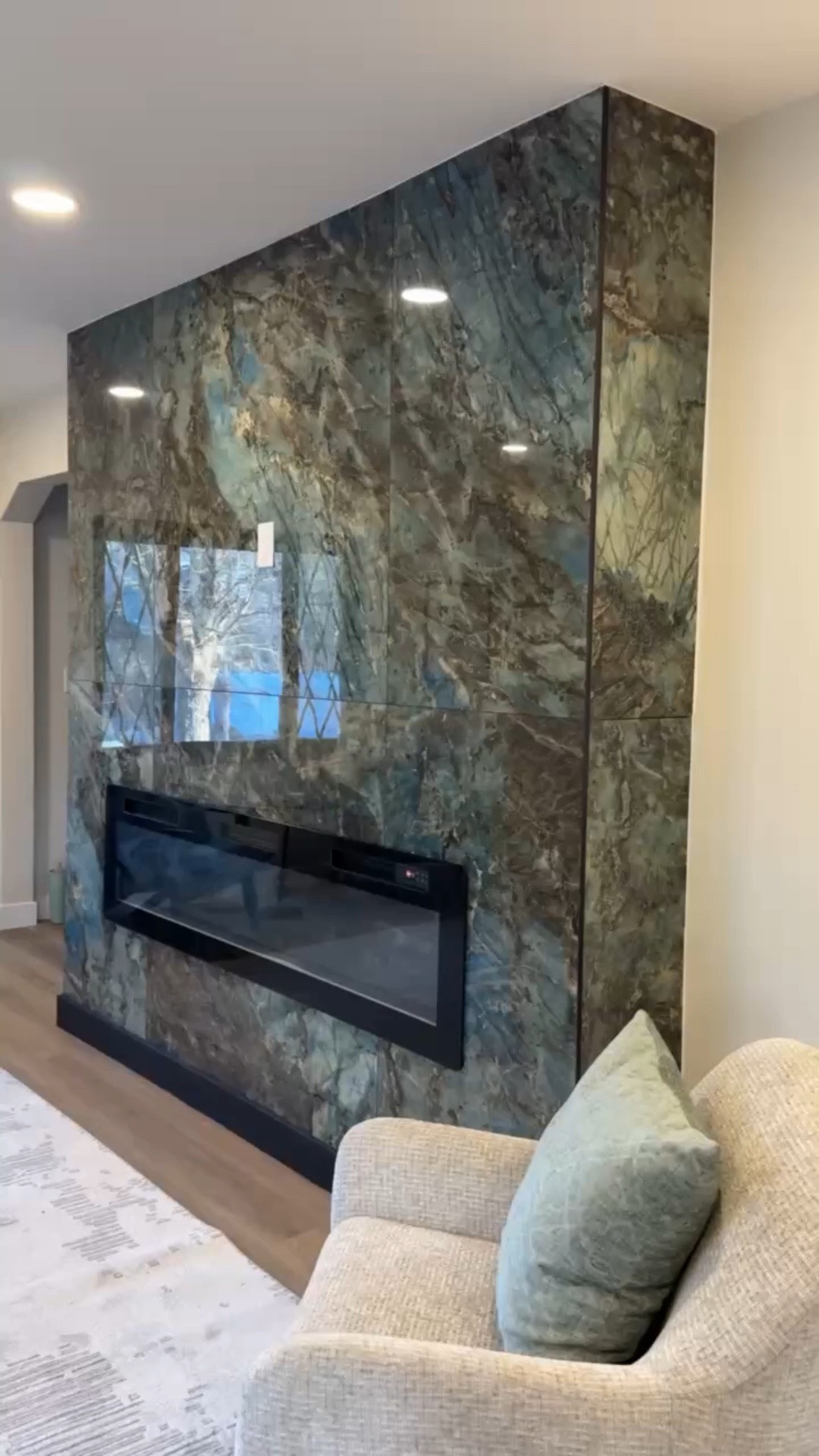 This is how we layer a neutral living room🤍  
Texture. Scale. Contrast. Balance.
Every piece earns its place.
Everything linked.

#AshleyHome modern decor, neutral living room, fireplace, transitional style

#LTKdayinmylife #LTKSaleAlert #LTKHome