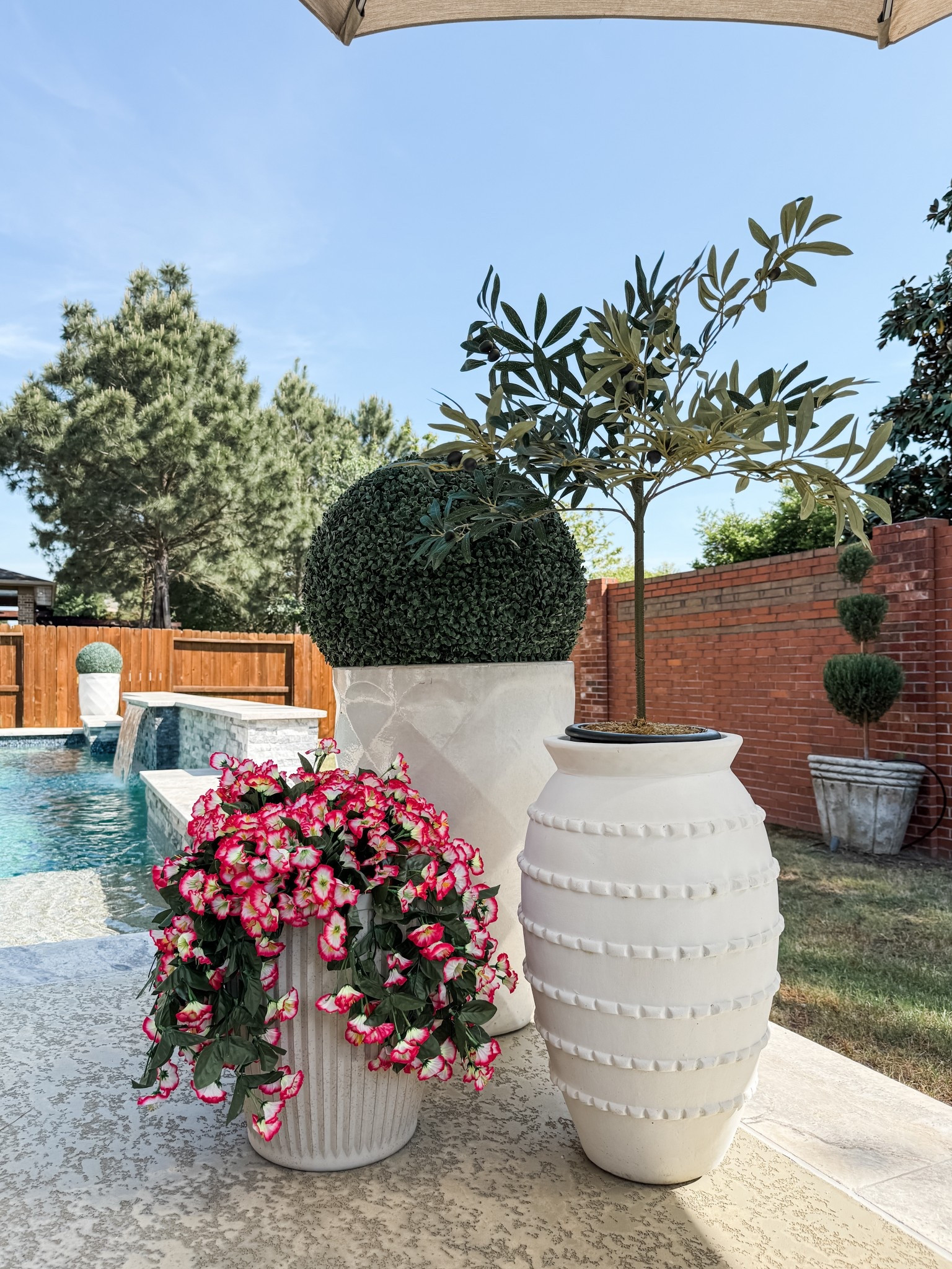 outdoor planters / faux plant trio / weather-resistant planters / modern outdoor decor / artificial plants / neutral patio styling / maintenance-free greenery / outdoor plant styling / realistic faux plants / porch decor ideas

#LTKFindsUnder100 #LTKHome #LTKSeasonal