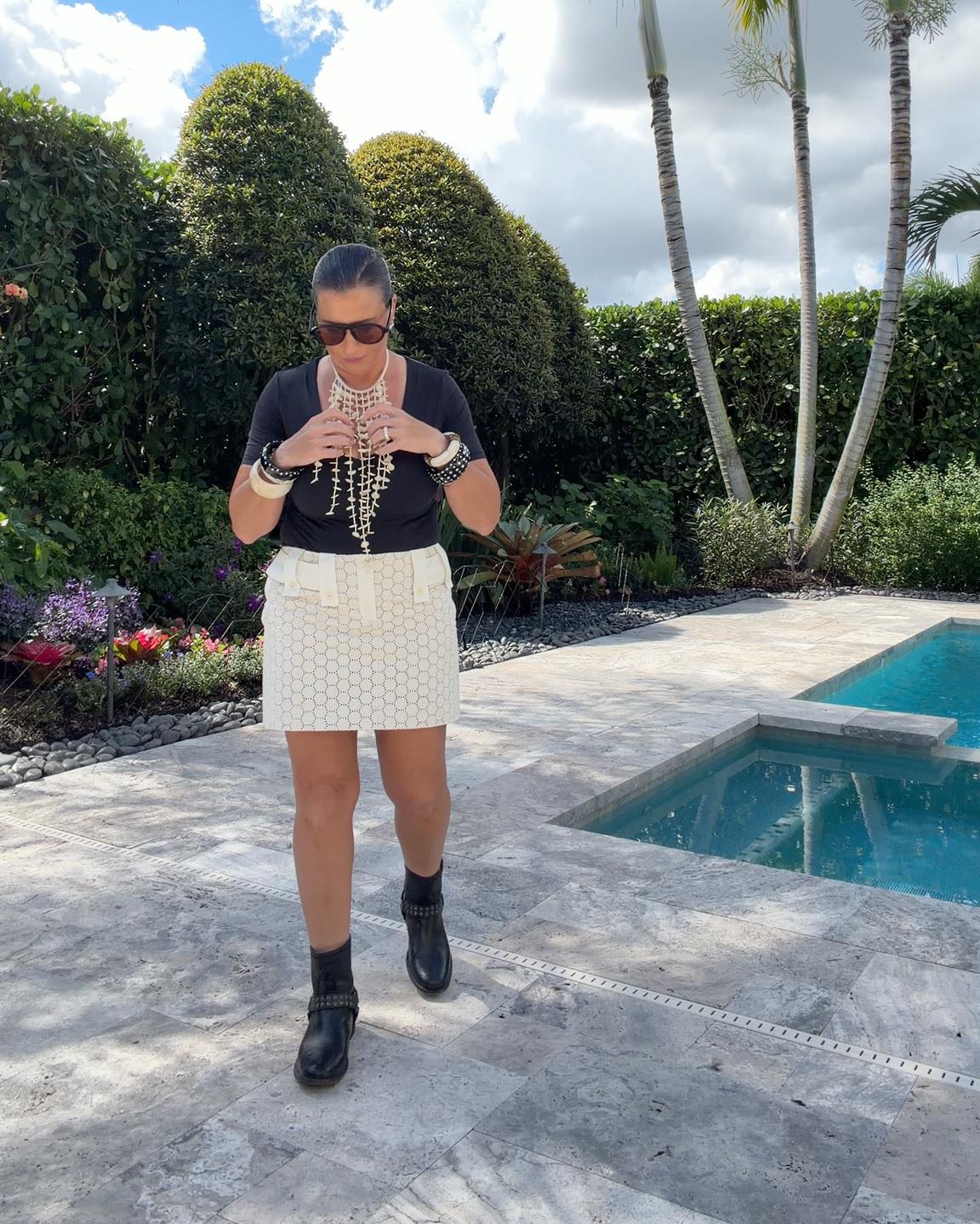 Who says minis are off-limits after 50? Not me.
This look proves that confidence never goes out of style.
I paired a classic black bodysuit with a textured cream mini, a WOW necklace, and moto boots for an unexpected mix of polish and edge.
Shop the full look — and similar pieces here— on my LTK 🖤

#LTKOver40 #LTKStyleTip