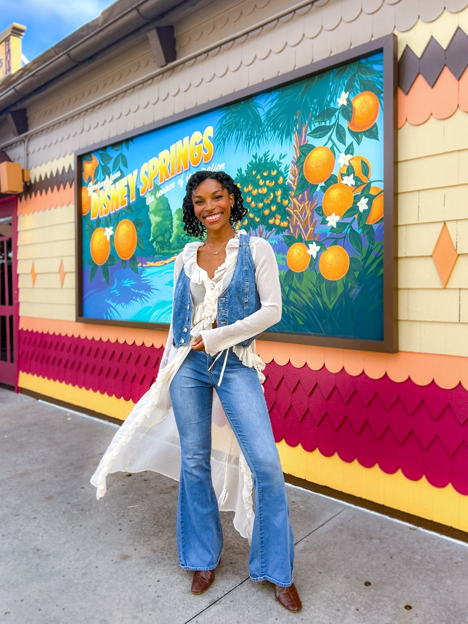 Denim Vest with flare jeans and a flower cardigan 

#LTKootd