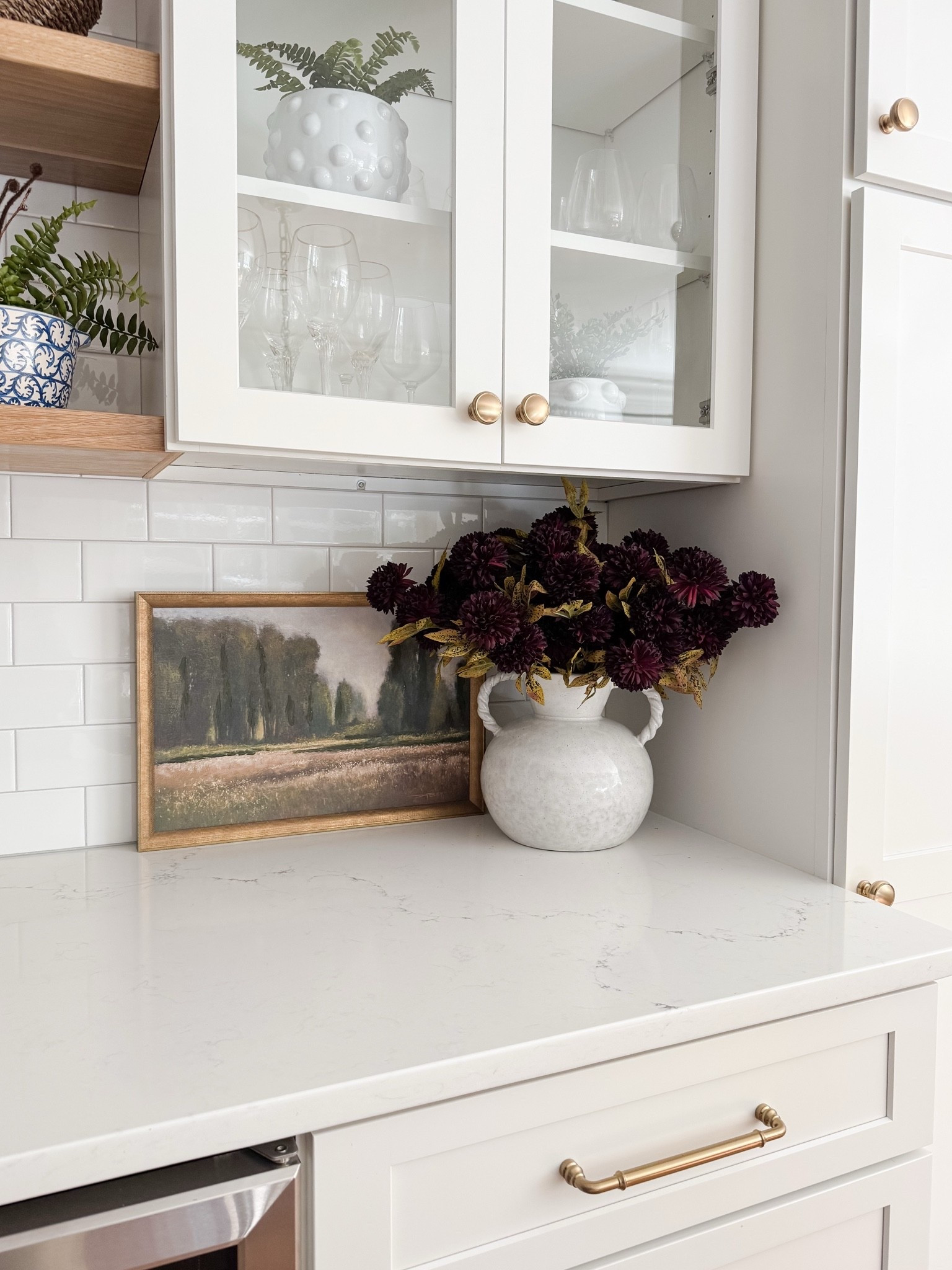 Built in cabinet styling with soft neutrals, glass fronts, and warm wood shelving that adds texture without clutter. This cape cod coastal kitchen keeps everything light, layered, and beautifully organized. Cape cod kitchen, coastal kitchen cabinets, glass cabinet styling, neutral kitchen decor, open shelf kitchen styling, amazon finds home decor, coastal neutral kitchen, sherri calnan home

#LTKHome