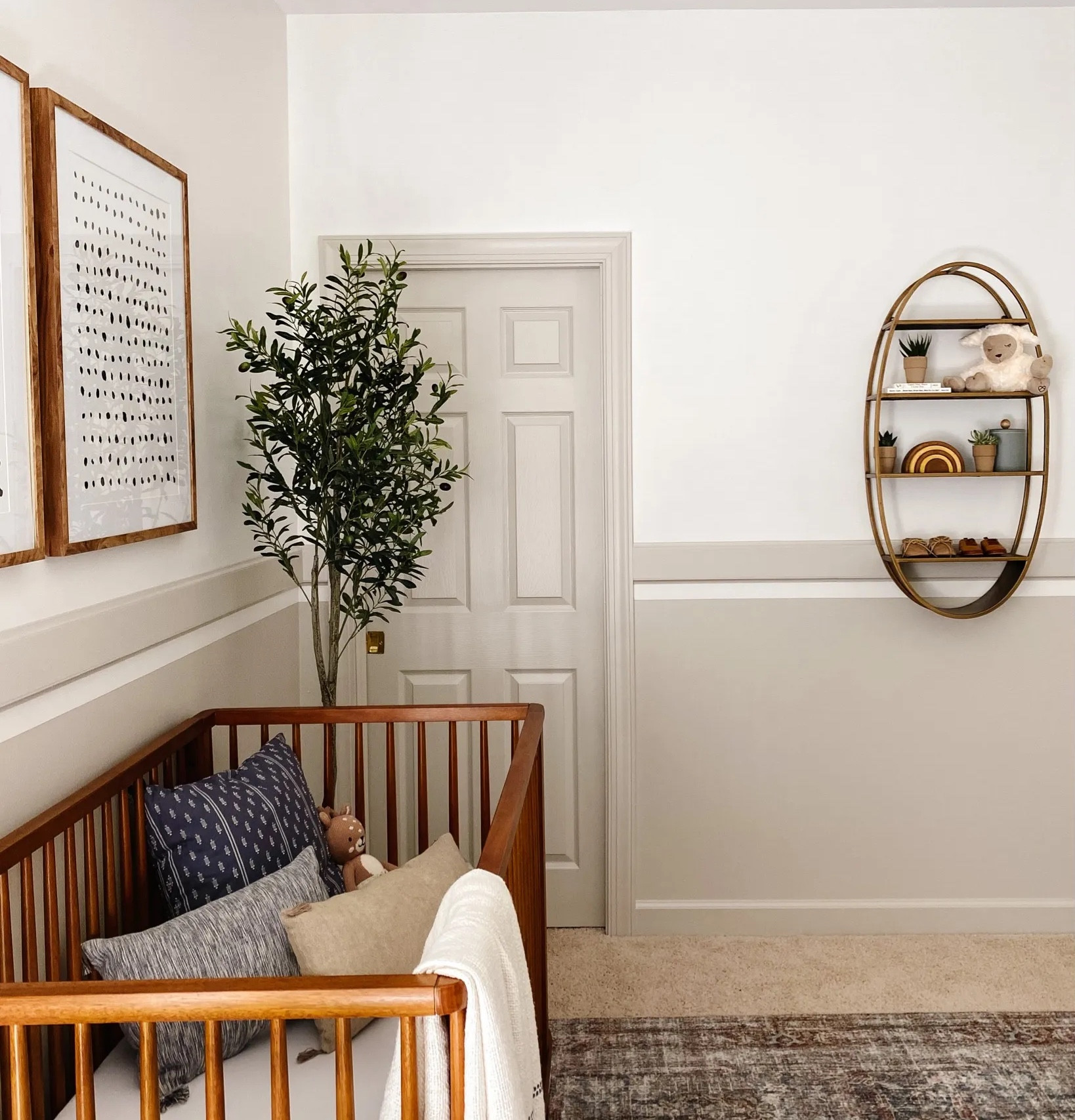 My baby boy is getting a big boy room so I had to share some pics from his nursery! We added a wooden dresser, dot artwork, rattan oval shelf, fake olive branch and a light green/gray finish for the ultimate neutral boy nursery. Nursery DIY, boy nursery, neutral nursery, home remodel

#LTKhome #LTKkids