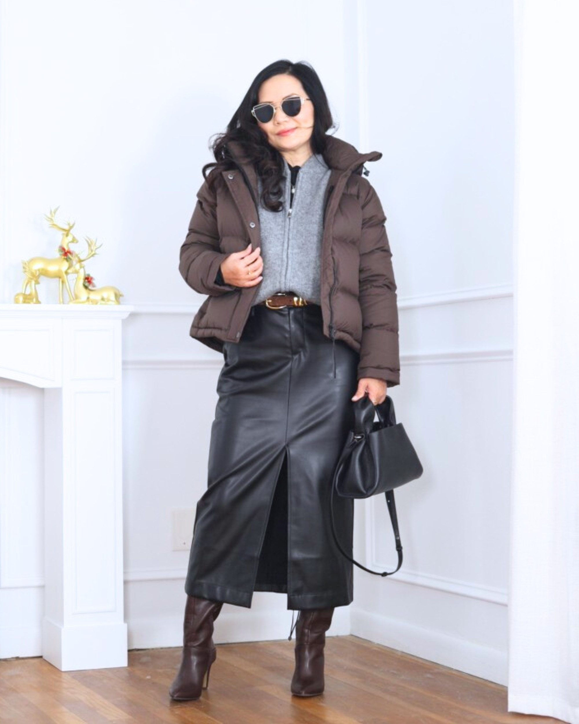 Mixing cozy and chic — a cropped puffer jacket from Quince layered over a sweater from On 34th, paired with a faux leather skirt and tall boots from LOFT. Warm, polished, and just the right amount of edge for cooler days. I’m 5’2, wearing size XS.

#LTKPetite #LTKOver40 #LTKootd