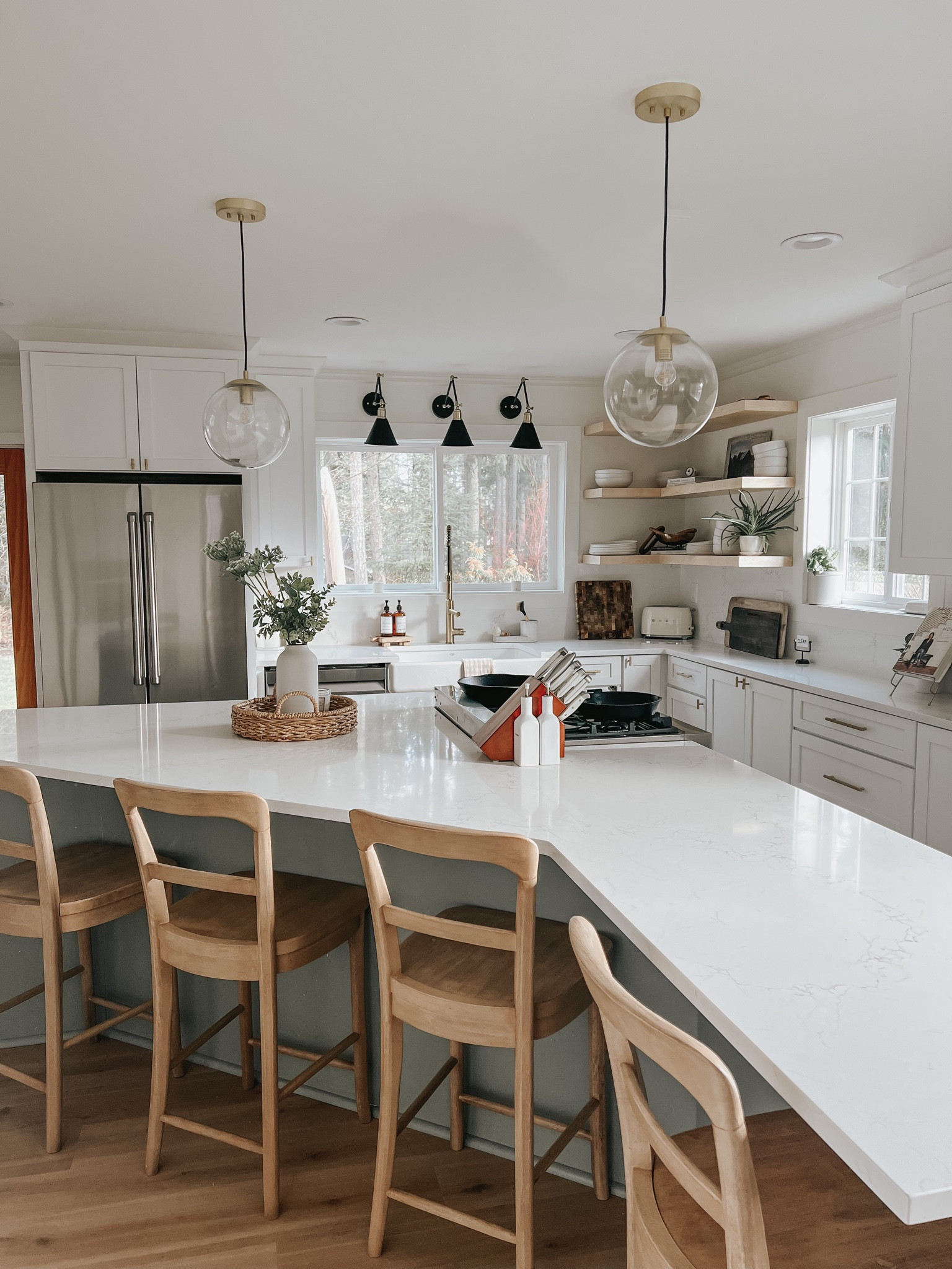 Sherwin Williams Evergreen Fog Kitchen Island

Modern Farmhouse kitchen, counter stools, pendant lights, sconce lighting, natural wood, open corner shelving

#LTKstyletip #LTKhome