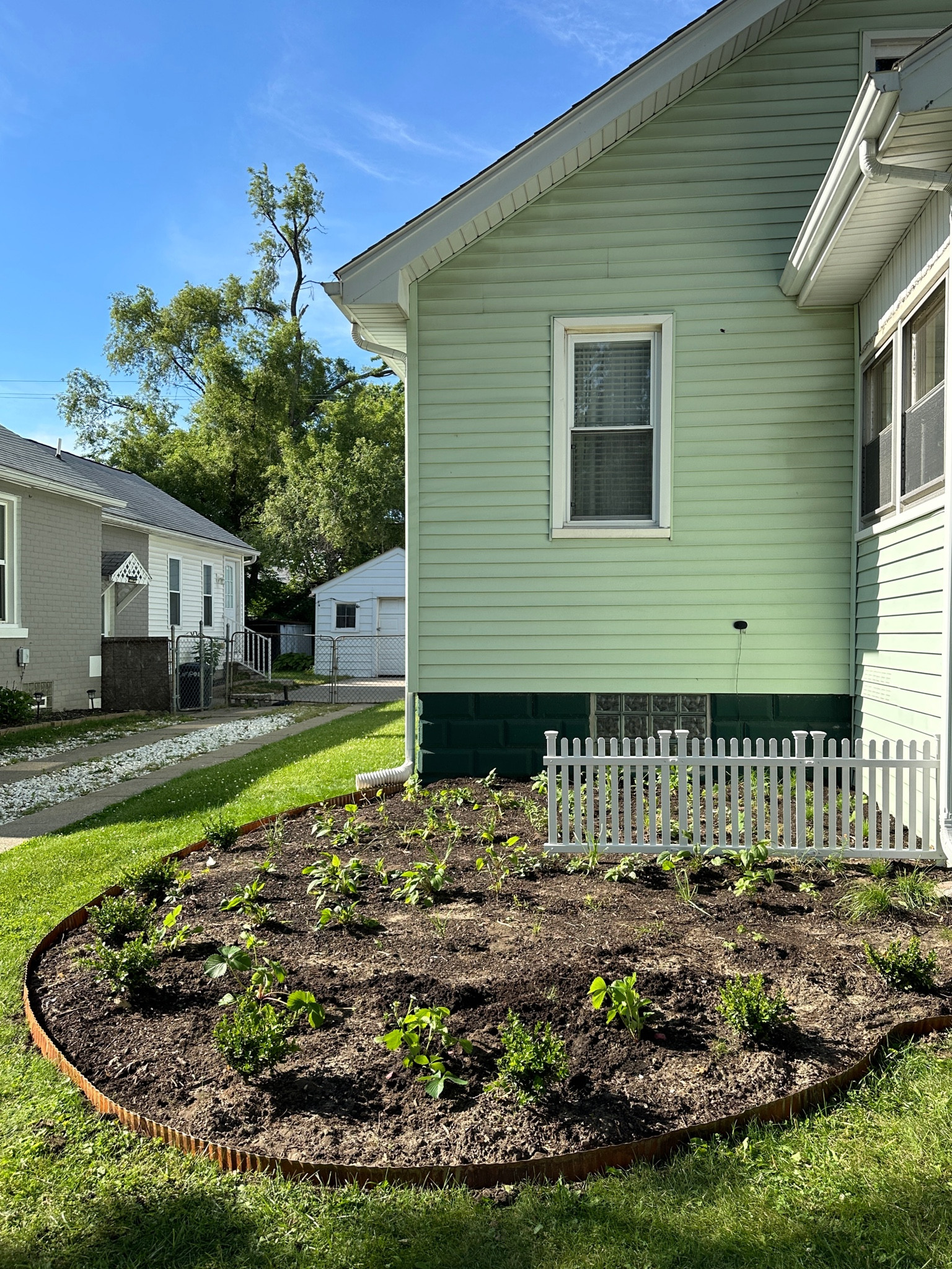 Cottage garden loading… 

This will be a native flower garden — we got our plants from My Home Park, and the white picket fence and corrugated pre-rusted garden edging are linked below!
