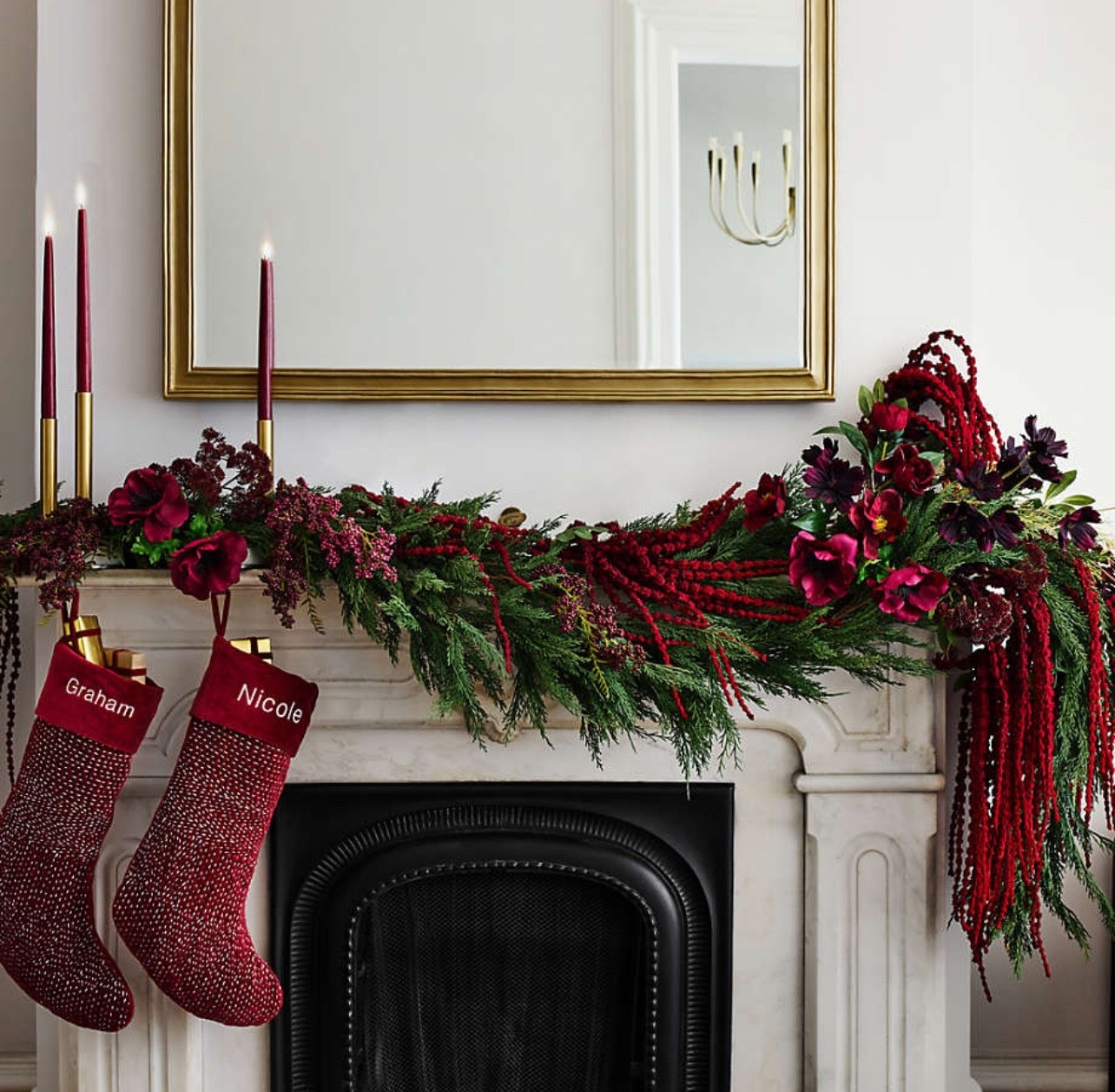 Mantel garland and decor 

Red, holiday decor, berry, Christmas stockings, Christmas stems, branches, florals, greenery, cedar, pine, mirror, candles, organic modern, transitional, minimalist, farmhouse, #LTKStyleTip, #LTKFamily 

#LTKFindsUnder100 #LTKHoliday #LTKHome