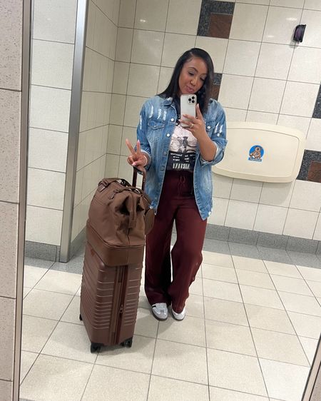 Heading out ✌🏽 Love a cute casual airport fit! Super comfy and non restricting! Wearing a Medium in the pants and a Small in the graphic tee! Denim boyfriend jacket I found similar as mine is suuuuper old and these sneakers run TTS. I got a men’s 8 and wear a women’s 9. 