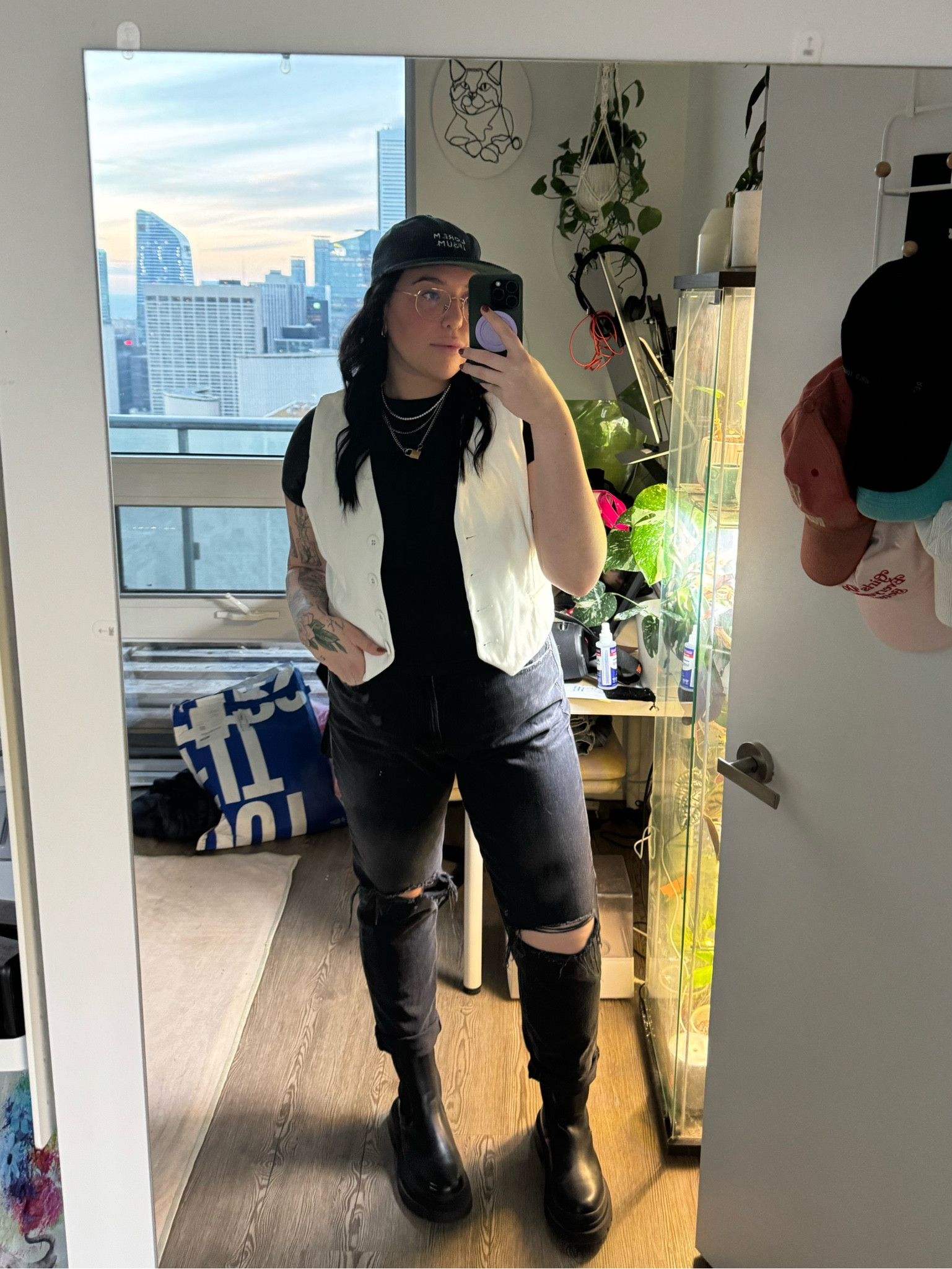 Stylishly edgy semi-masculine lesbian fashion: ripped black jeans paired with chunky black boots and a sleek black fitted T-shirt under a crisp white vest. Adorned with white gold chain necklaces and a classic pearl necklace. Perfect for queer style inspiration, lesbian outfit ideas, androgynous looks, LGBTQ+ fashion trends, and powerful statement ensembles. 

Masc lesbian, lgbtq style, masc fashion, stem fashion, stem style, lesbian outfit inspiration, midsize fashion, size 14 outfit 

#LTKmens #LTKmidsize