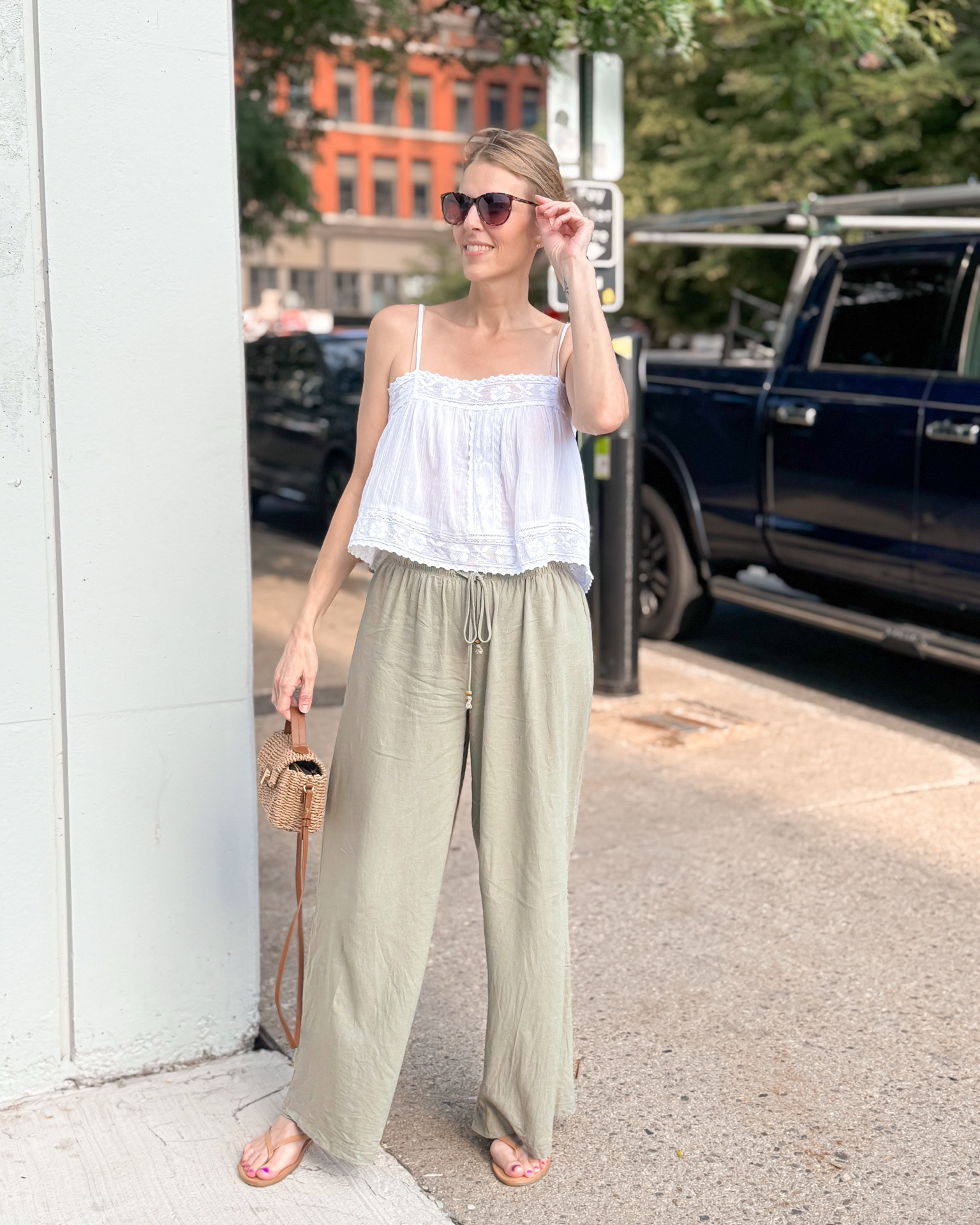 Summer days are better in easy outfits and good food. ☀️🤍 Linen pants, a breezy white cami, comfy sandals, and a woven bag = my kind of everyday summer style. Finished the day with Thai food, and it was the perfect way to end it. 🥢✨

#LTKOver40 #LTKSeasonal #LTKootd