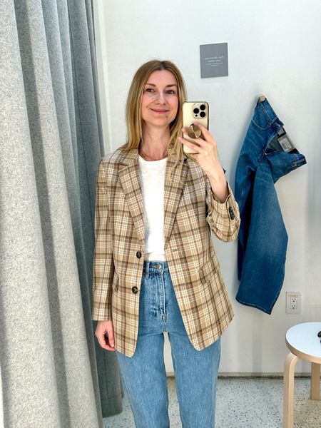 Light weight plaid blazer in neutral colors, perfect for spring. Underneath a comfy white t-shirt and a pair of high waisted blue jeans. This is the type of daily uniform that you can wear on repeat 
