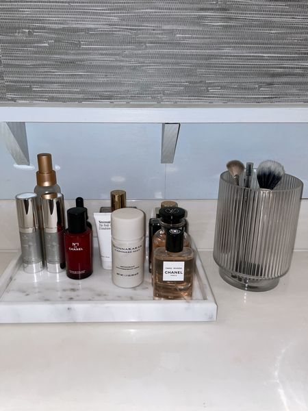 Bathroom Beauty Vanity Tray! Follow @hollyjoannew for style and beauty! Glad you’re here babe! Xx 

White Marble Tray Rectangular 
CB2 Fluted Glass Vase 
Chanel No 1 Revitalizing Serum
Chanel Paris Riviera Perfume
Refy Makeup Brush
Skinmedica Lumiveive Day Night
Necessaire Lotion
Donna Karan Cashmere Mist Deodorant 
Tom Ford Soleil Blanc Shimmer Oil
Killian Paris Intoxicated 
Skinmedica H A Intensifier 


#LTKhome #LTKbeauty #LTKfindsunder100