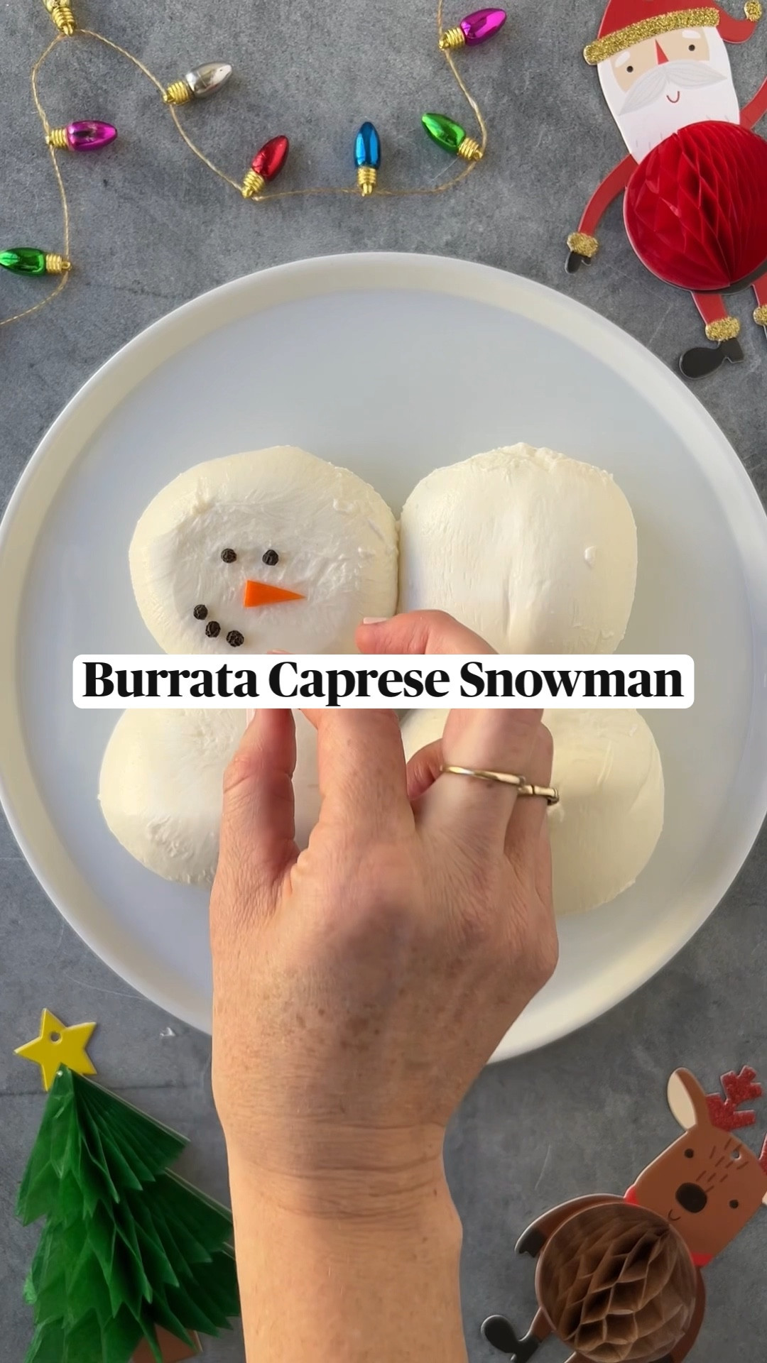 INGREDIENTS 
4x 4oz burrata balls
19 peppercorns
1/4 carrot, peeled and cut into triangle nose shape
4 basil leaves
1 oz arugula, pre-dressed with olive oil & salt
8 oz cherry tomatoes, chopped, pre-dressed with olive oil & salt
flakey salt
Olive oil
Balsamic glaze/reduction (optional & not pictured)
 INSTRUCTIONS

1. Lay 4 burrata bowls down on a plate, two stacked on each other side by side, resembling snowman.

2. Lay peppercorns down on the burrata balls resembling a face. Lay the carrot slices down for the “noses”.

3. Place the peppercorn “buttons” on the lower burrata balls, and place two basil leaves under the top burrata balls to be their “scarves”. 

4. Dress the bottom of the plate with arugula, and place the tomatoes at the top of the plate.

5. Sprinkle the flakey salt to taste on the arugula, tomatoes, and burrata. Serve with Crostini and enjoy!

6. Option to add balsamic glaze on the tomatoes and arugula before serving.

#ainttooproudtocheese

#burratagram #feedfeed #burrata #thatcheeseplate #food52 #traderjoeslist



#LTKHoliday #LTKSeasonal #LTKGiftGuide