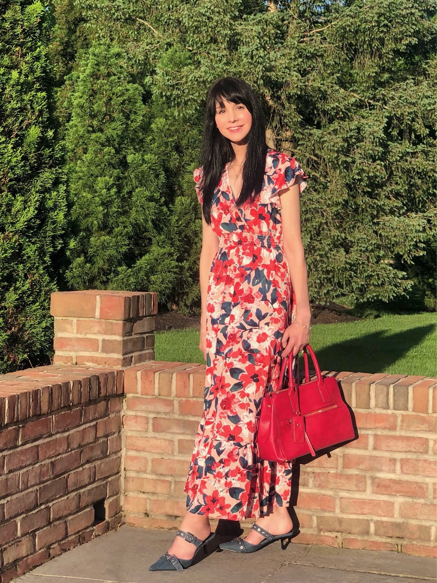 Wishing you a peace filled Memorial Day weekend! During these three days of the  unofficial start of summer filled with barbecues and fun activities, let’s all pause to remember the reason behind the holiday. We honor and are grateful for the men and women who have died in the service of our nation—fighting to protect our freedom.

This red, white and blue floral dress has a patriotic vibe and is perfect for summer days and outings! Paired here with denim kitten-heel buckle shoes and a red bag for an extra holiday look. 