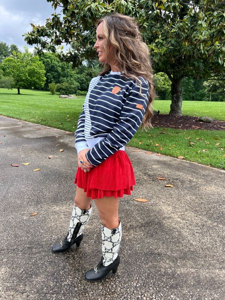 Need ideas for dressing up a pullover? Try a fun skort or pair of shorts along with statement shoes. I paired this navy and white striped pullover from Wanakome with red skort for a patriotic look  

#LTKOver40 #LTKStyleTip #LTKSeasonal