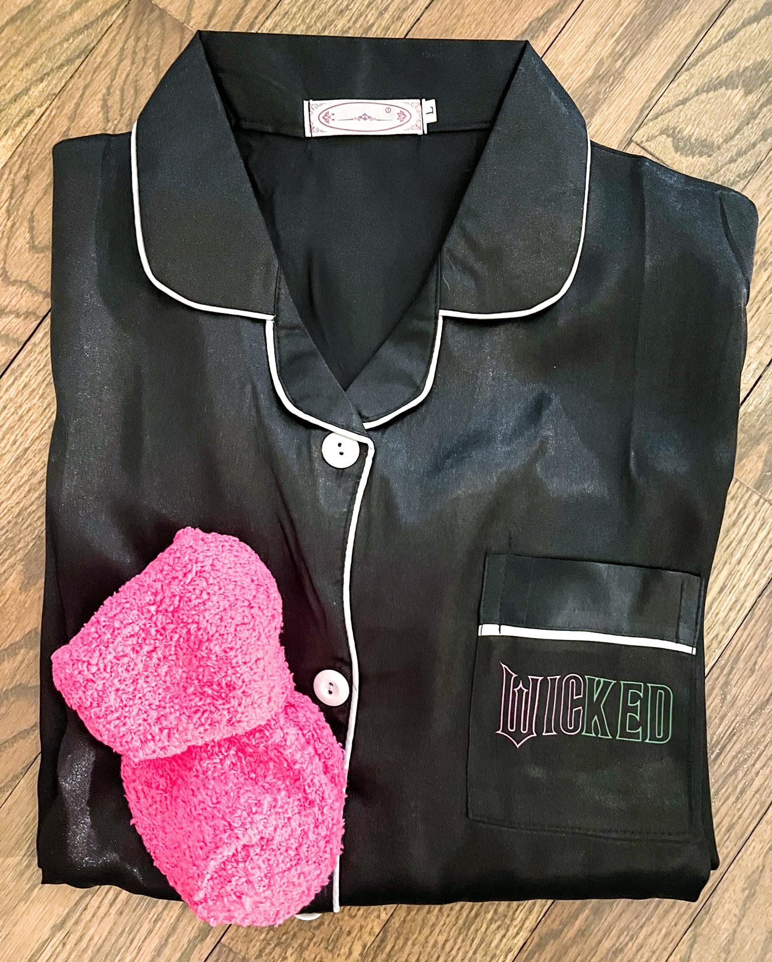 Wicked party: satin nightgowns with DIY wicked logo on pocket 
And matching pink fuzzy socks

#wicked #wickedparty #birthdayparty

#LTKParties #LTKKids