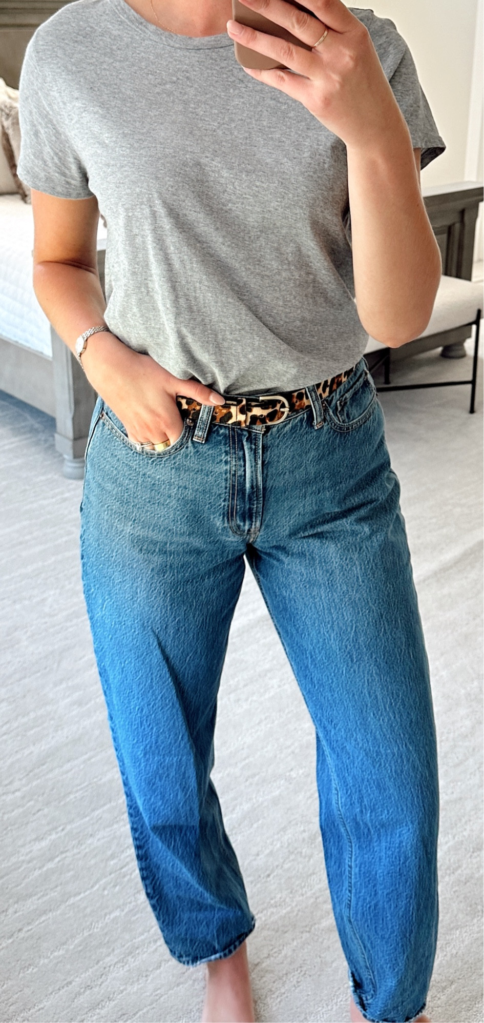 Easy outfit idea - gray tshirt (wearing a large for an oversized fit), leopard belt (xs/s), tapered jeans (28L) 

#LTKSaleAlert #LTKFindsUnder100