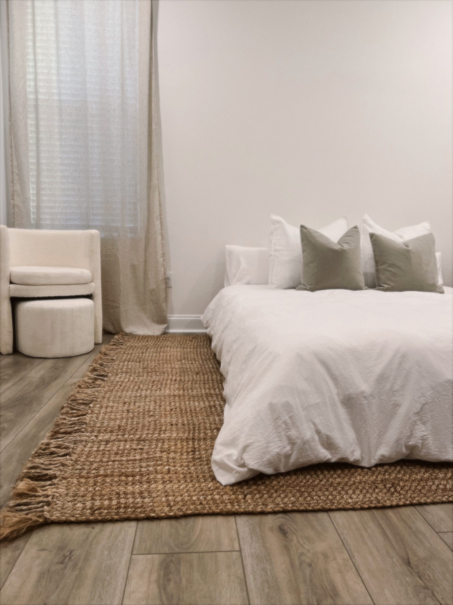Still have a long ways to go in the master bedroom, but our jute rug came in today & I had to share 🥹 
I also ordered our bed today & can’t wait to update when it comes in!

RUG —
For reference, we have a California king bed. I got the 7’6 x 9’6 size in the color “natural.” I looked at soooo many, and I’m happy this was the winner. It did have that typical jute smell when it arrived, so I recommend letting it air out in the sun before putting it in place. We even tried a trick we read about online - sprinkle it with a light layer of baking powder, let sit 10-20 mins & vacuum. Repeated a couple times & that seemed to help too! Worth it for the look that I was going for. Haha

DUVET COVER — 
California King in white. 
(Pro tip: size up from your mattress size for a more plush, oversized look. Obviously couldn’t do that with ours since it’s a Cali, but I’ve always done that in the past & loved it!)

DUVET INSERT —
California King, white/medium-weight. 

LARGE THROW PILLOW COVERS —
White, 26”x26”

LARGE THROW PILLOW INSERTS —
28”x28”
(Pro tip: size up in inserts for a more full finished look)

TAUPE THROW PILLOWS —
Moonbeam with feather insert (x2)

CURTAINS —
Linen, 52x108
(You’ll need to measure your specific window width/ceiling height, of course. Pro tip: measure and order curtains based on your actual ceiling height and hang them higher than the actual window for a luxurious, elongated look. For example, our bedroom ceilings are 108” so I ordered the 108” curtains.) 

CURTAIN RODS —
Brass

CHAIR — 
I found this exact chair at HomeGoods (so I can’t source/link it), but I’m linking a similar find from Target. 



#LTKstyletip #LTKhome #LTKSeasonal