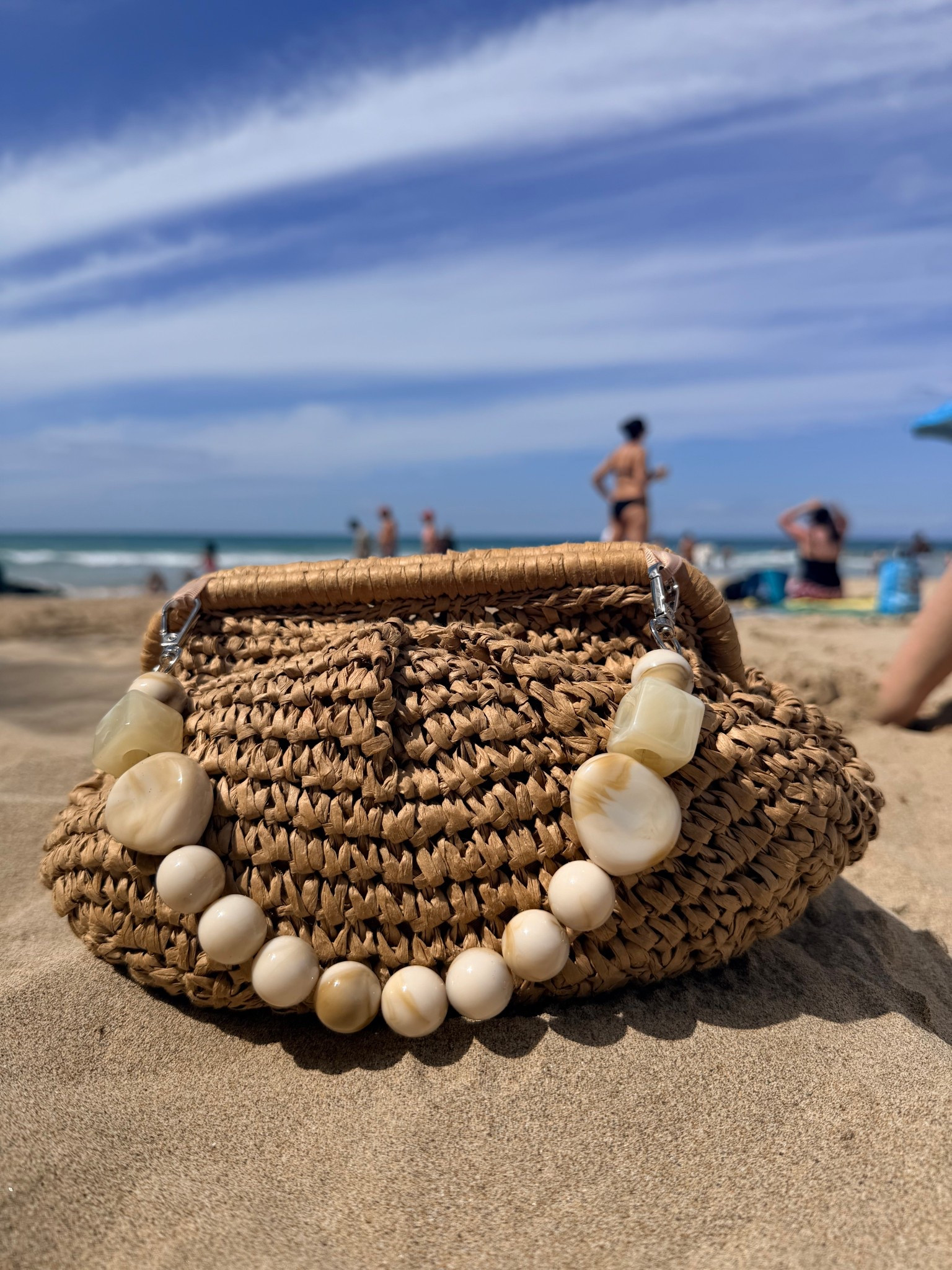 Obsessed with this beach vibe clutch purse. The strap can be removed or tucked in too which makes it so versatile. She goes everywhere with me 

#LTKmomlife #LTKTravel #LTKdayinmylife