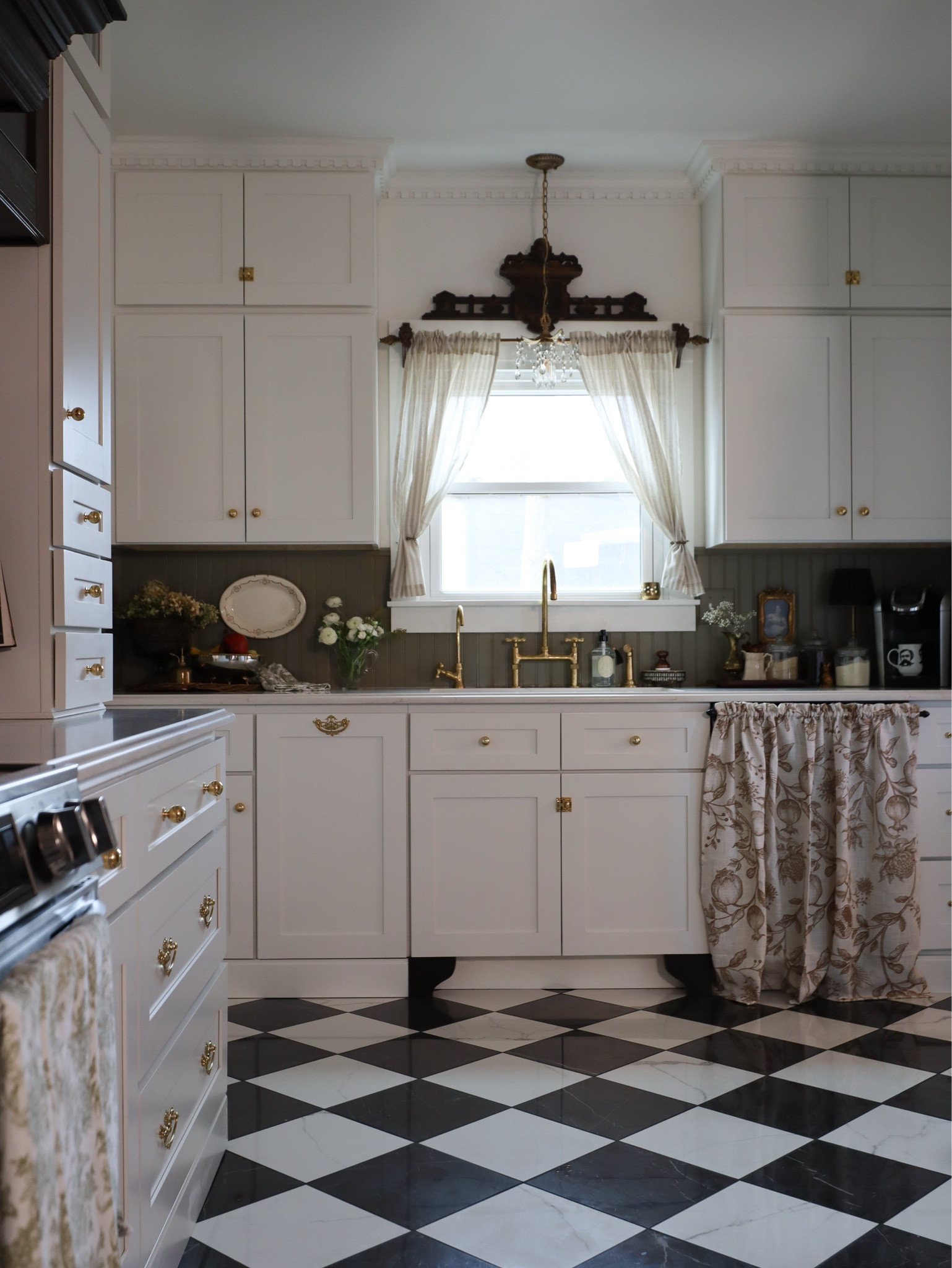 Timeless kitchen details that bring so much vintage charm! ✨ From the unlacquered brass faucet to the striped café curtains and checkerboard flooring, every detail was chosen to create a space that feels classic and curated. Linking my favorite kitchen finds here, including my hardware, sink, and skirted cabinet fabric!

#LTKHome