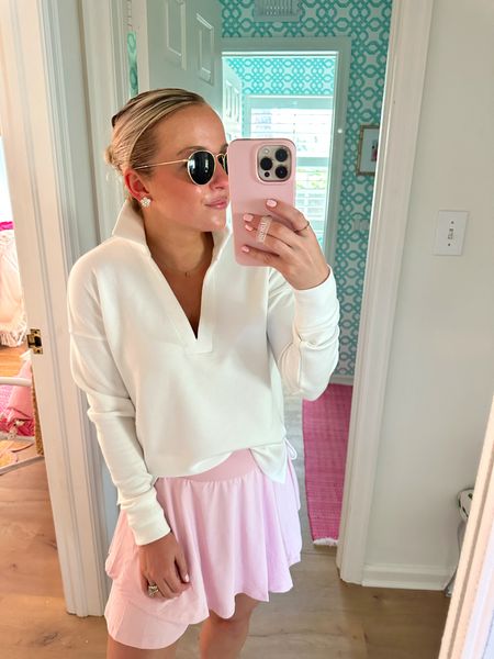 Blush pink pickleball or tennis skort! Depending on your height it would be long enough for golf too. I’m in the XS and would say it’s true to size. Super cushiony white sneakers and my favorite no-show socks are true to size too! Pullover runs large, also in the XS. Use code AMYXSPANX for a discount on it! 🤍 #Spanx #pullover #pickleball #skort 

#LTKActive #LTKSeasonal #LTKstyletip