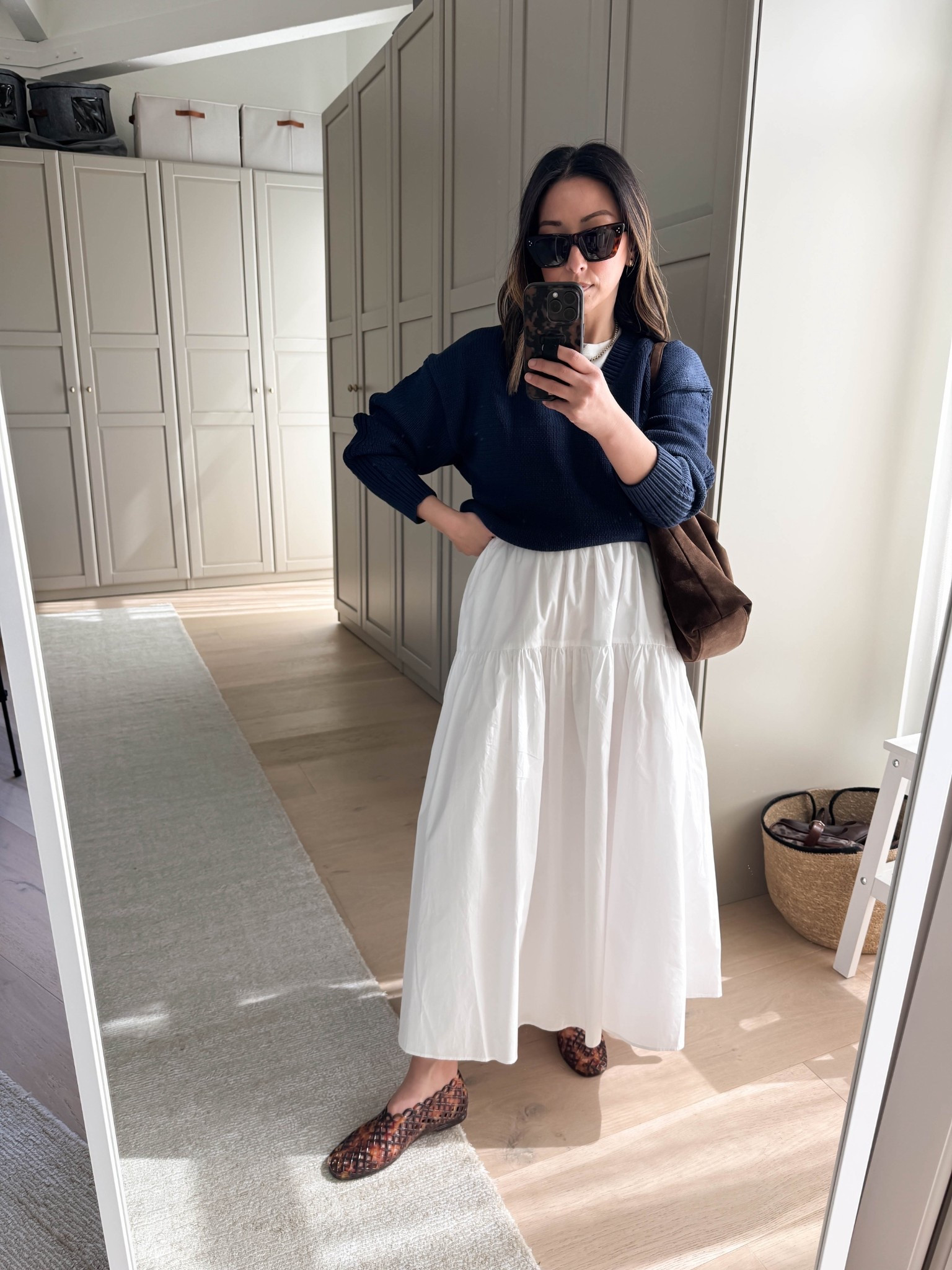 Spring outfit ideas with white skirts. I found the perfect v-neck sweater. This length and fit work perfectly with skirts and dresses because it's not overly long. Love the chunkiness of it too!

J.Crew sweater small
Everlane tee medium
Almina Concept skirt small - sadly old 
Steve Madden Jelly flats 5 - run a half size big
Liffner Hobo Pillow bag
Celine sunglasses
Quince earrings
Dorsey James necklace 15"

Petite style, spring style, spring outfits 2026, white skirt, skirts 

#LTKootd #LTKSeasonal #LTKPetite