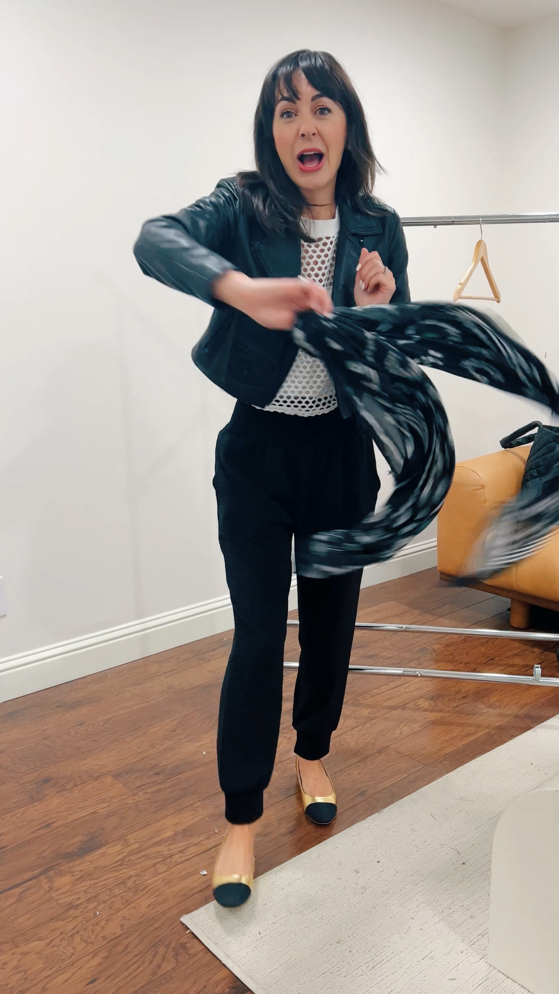 Texas Travel Outfit that works on the way when it’s raining and where it’s triple digits when I land.

Always a high-low mix of brands, my warmest layer, a sports bra, and scarf