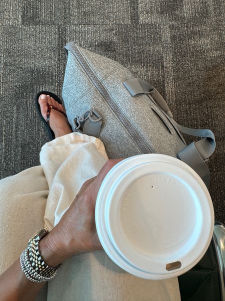 Travel vibes. My favorite new carry on that holds my lap top and other essentials, comfy clothes, my newest flip flops, and a coffee. 
kimbentley, summer outfit, travel outfit, petite style, sandals,

#LTKtravel #LTKitbag #LTKshoecrush
